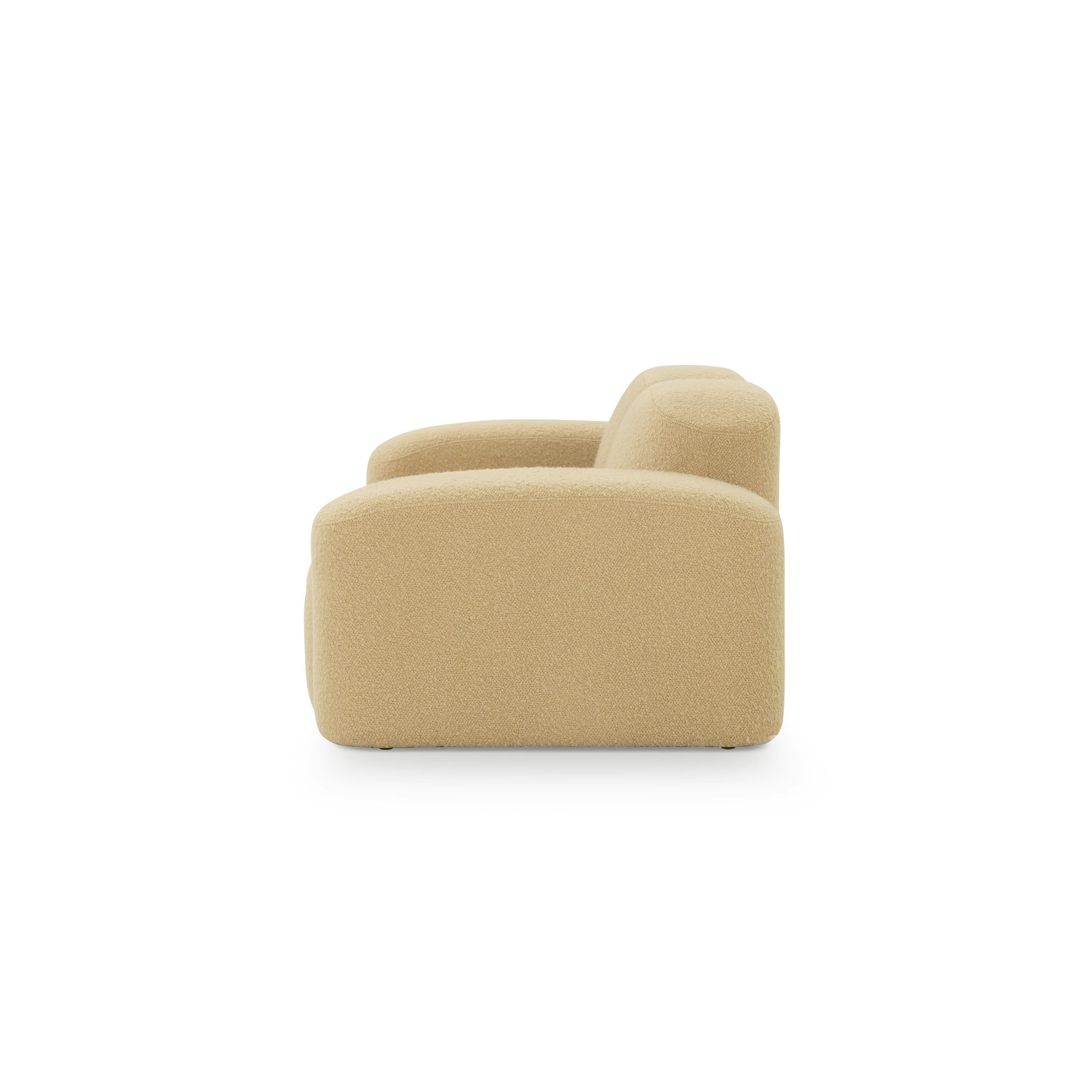 A Muse Sofa in Airlie: Camel viewed from the side.