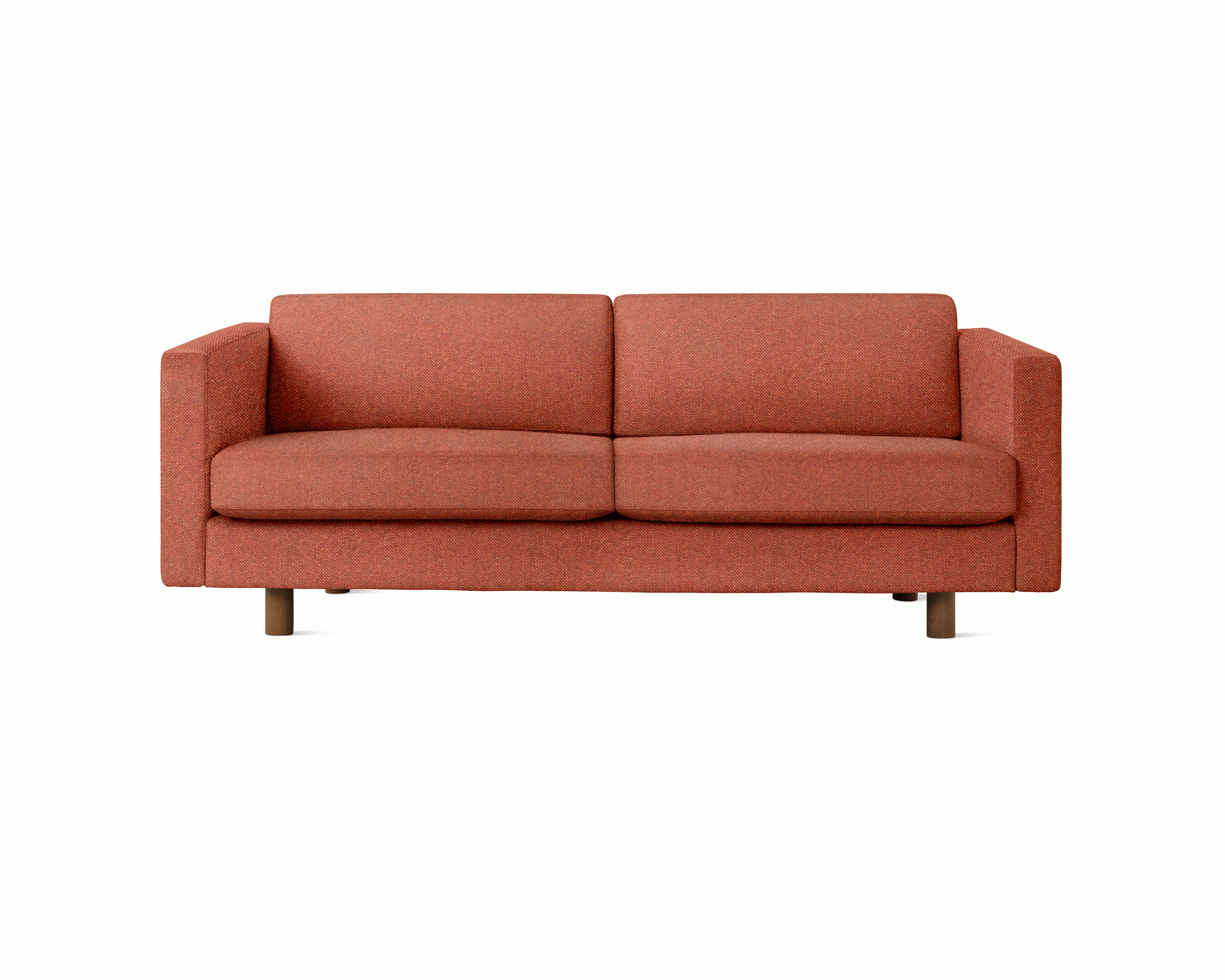 A Lispenard Sofa in Clayware upholstery with walnut legs viewed from the front.