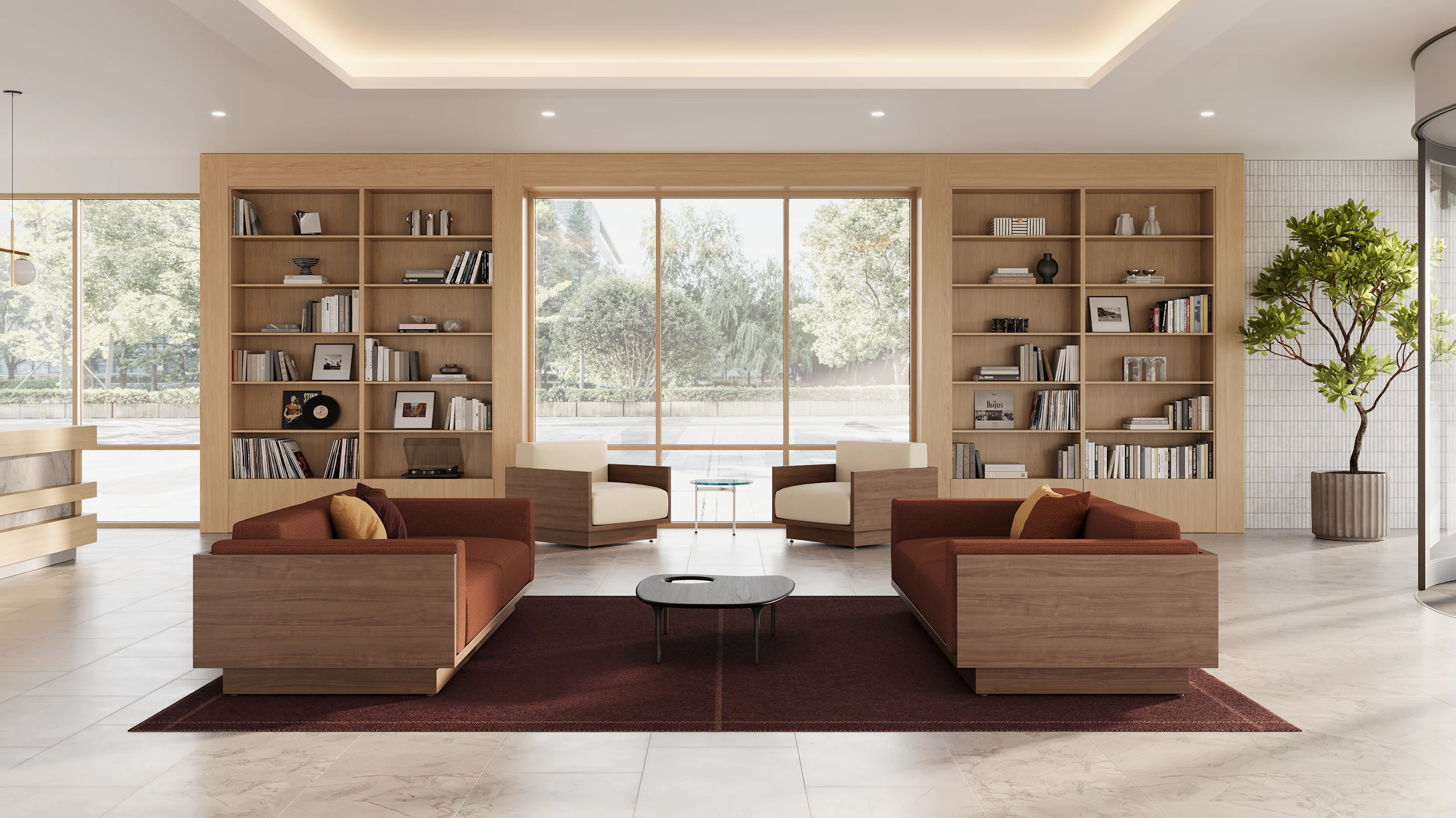 Pawson Drift Sofa Group in walnut with sienna textile cushions and white leather cushions near an oak bookcase in a hotel lobby