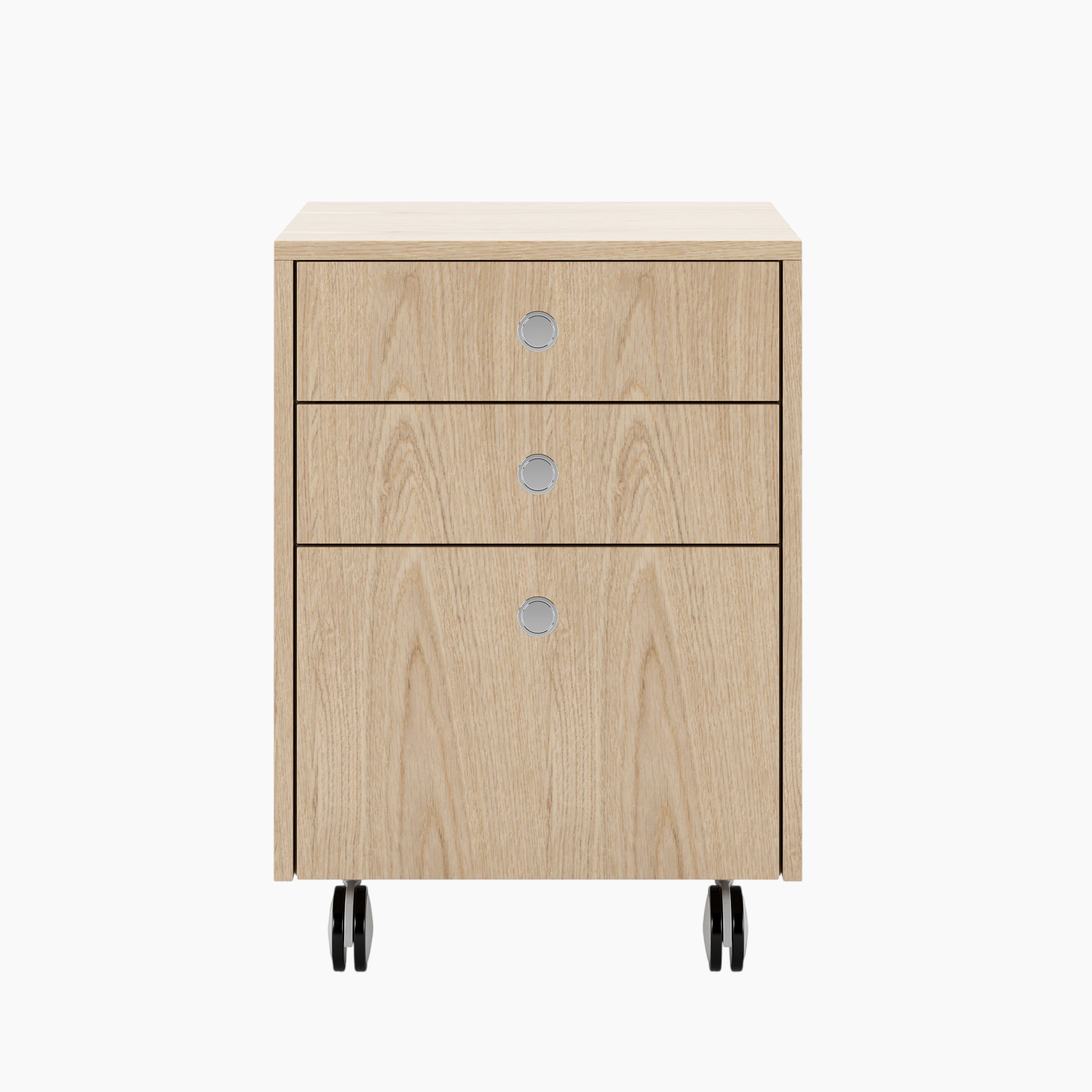 Sled Base Mobile Pedestal in oak with three drawers and chrome pulls on casters viewed from the font.