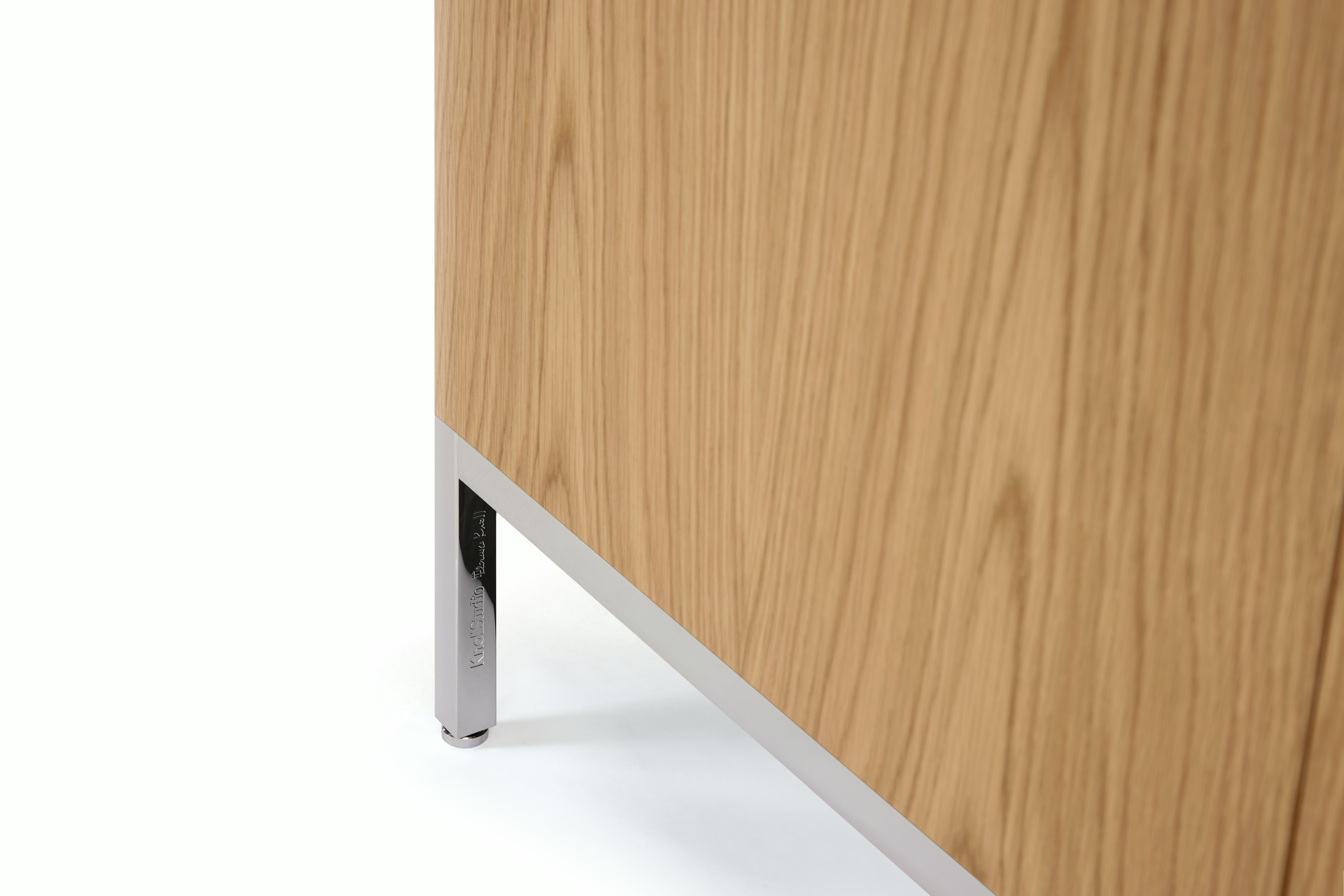 Detail image of a light brown wood Florence Knoll Credenza.