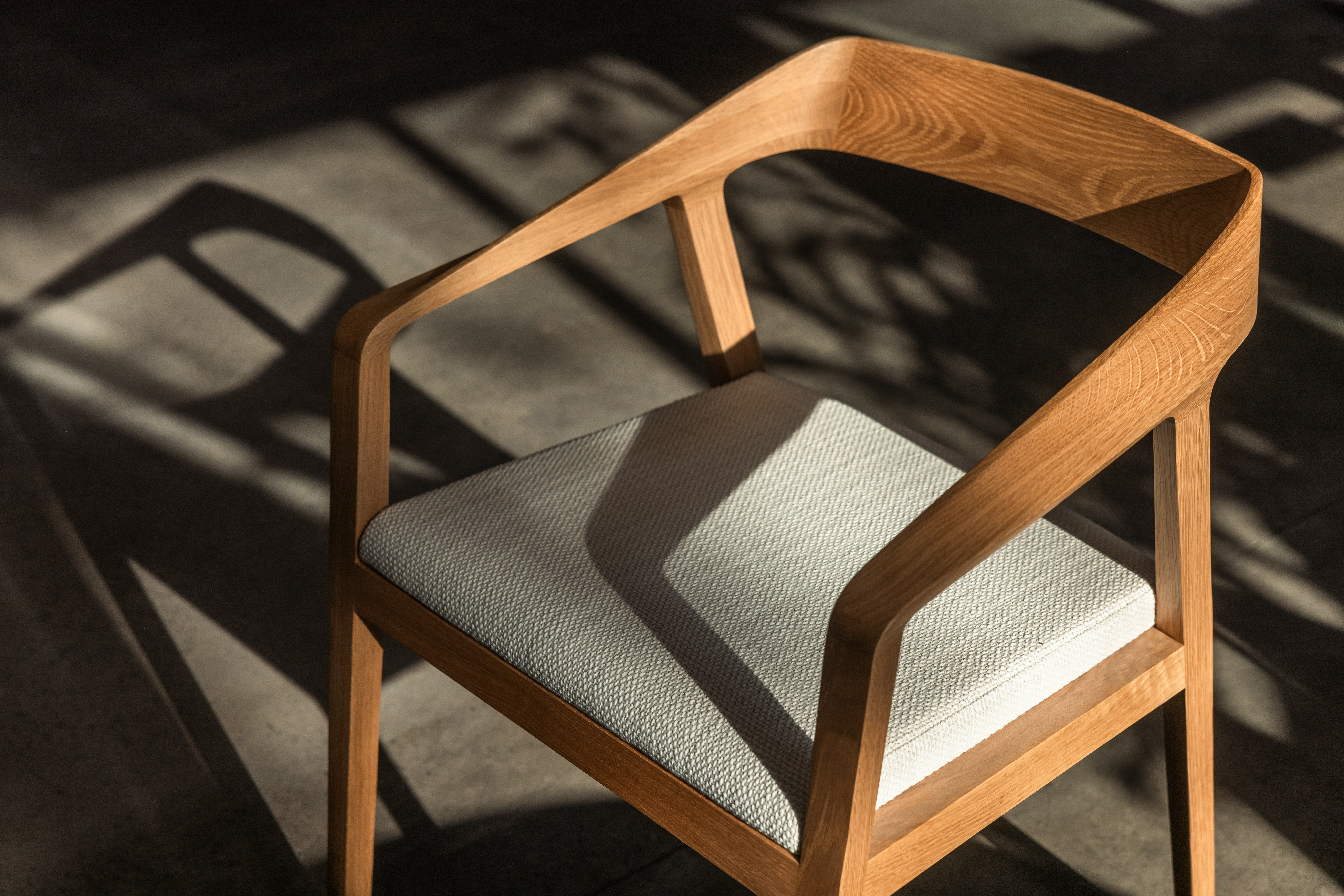 Full Twist Armchair with grey upholstered seat