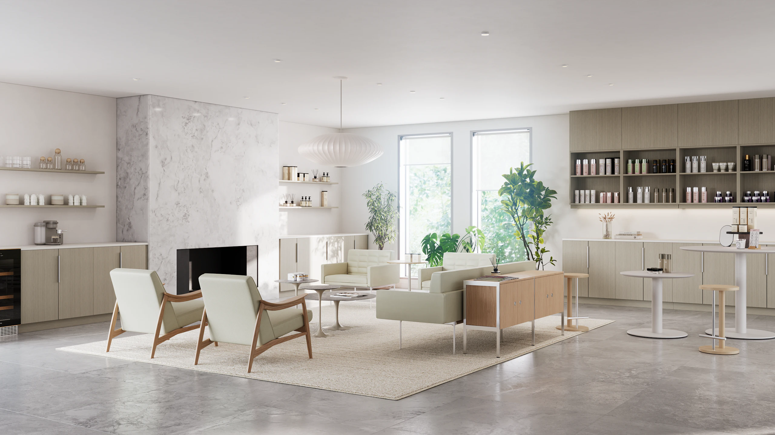 A bright, naturally lit boutique waiting area furnished with Herman Miller Aspen Lounge Chairs, Nelson Saucer Bubble Pendant lamp, Knoll Saarinen Side Tables, and a variety of green foliage.