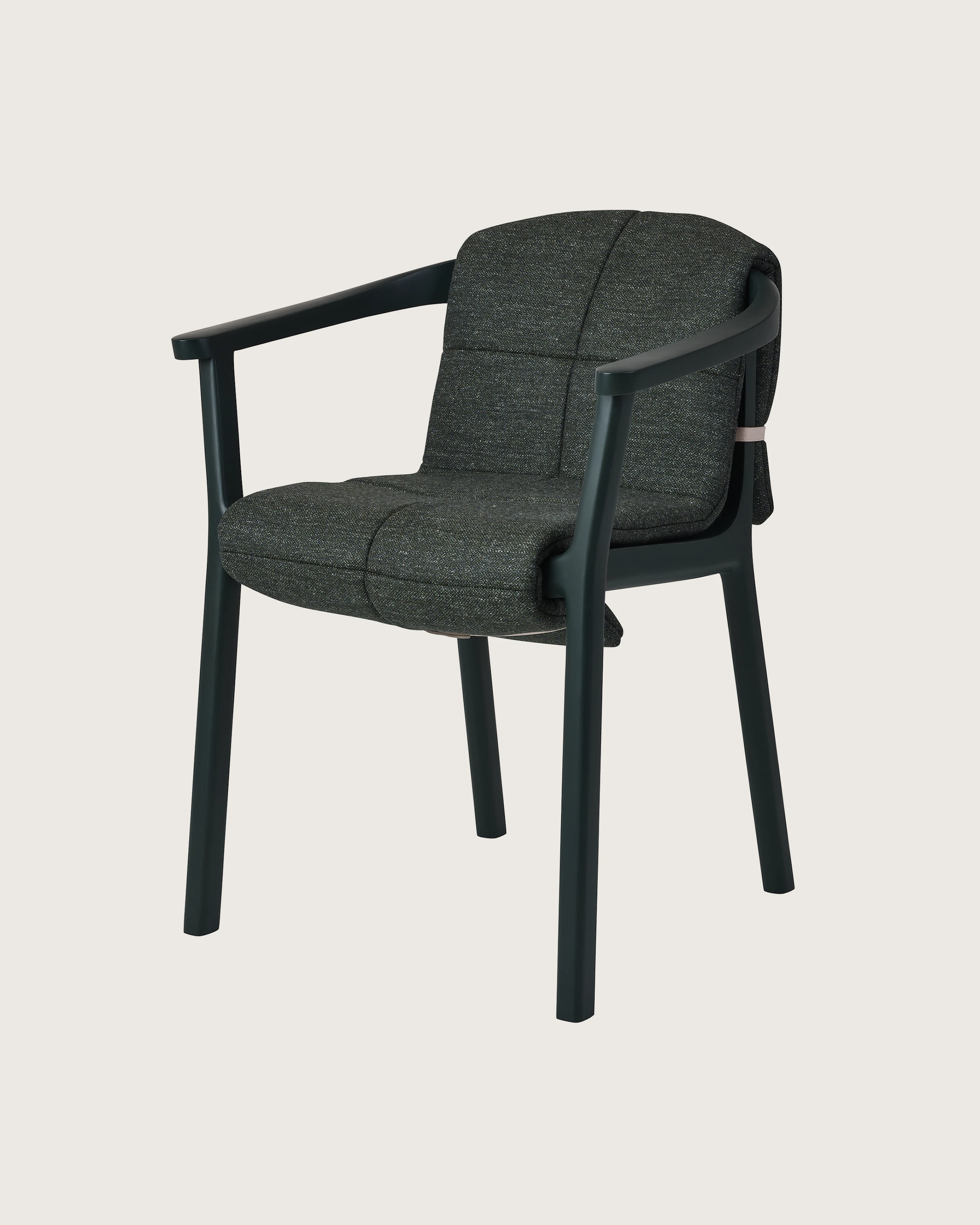 Lijn Armchair by Carole Baijings for Geiger in Ivy frame with quilted wrap in Bellano Black Green, angled front view on a white sweep.