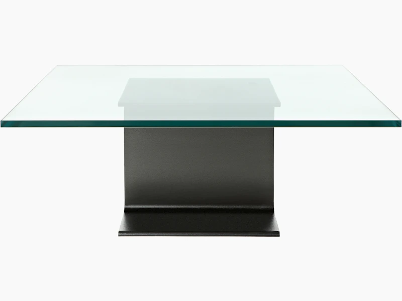 A glass-top I Beam coffee table, oriented to display the cast-aluminum pedestal's central section.