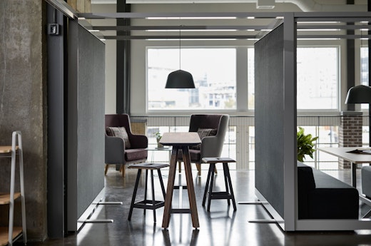 rockwell unscripted creative wall shared walls tall table drink rail counter height easy stools highback chair lounge muuto ambit pendant lamp lighting