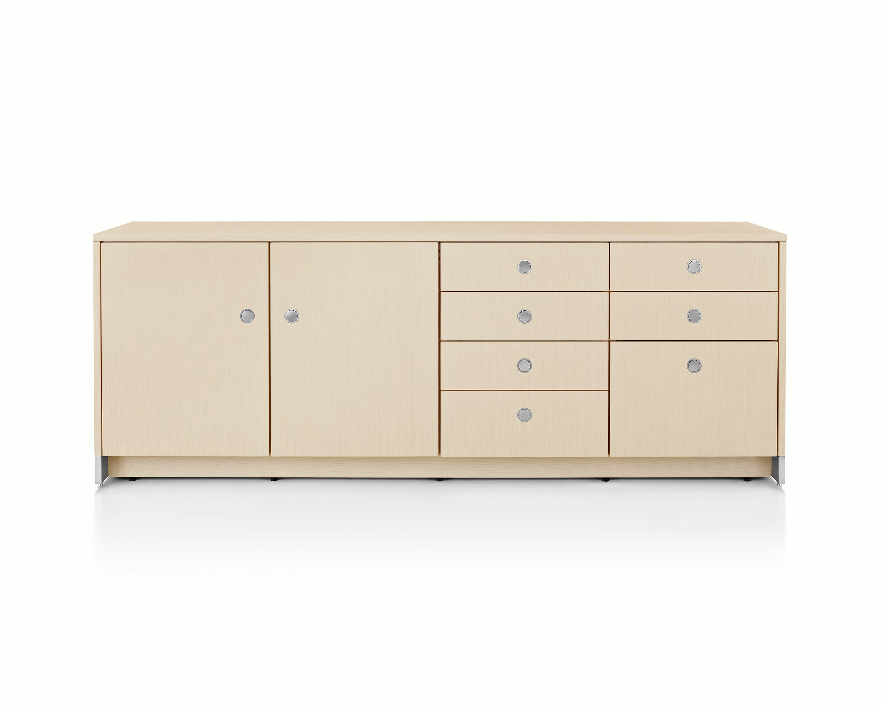 A four-unit Sled Base Storage credenza with a light wood finish and a combination of hinged doors, box drawers, and file storage.