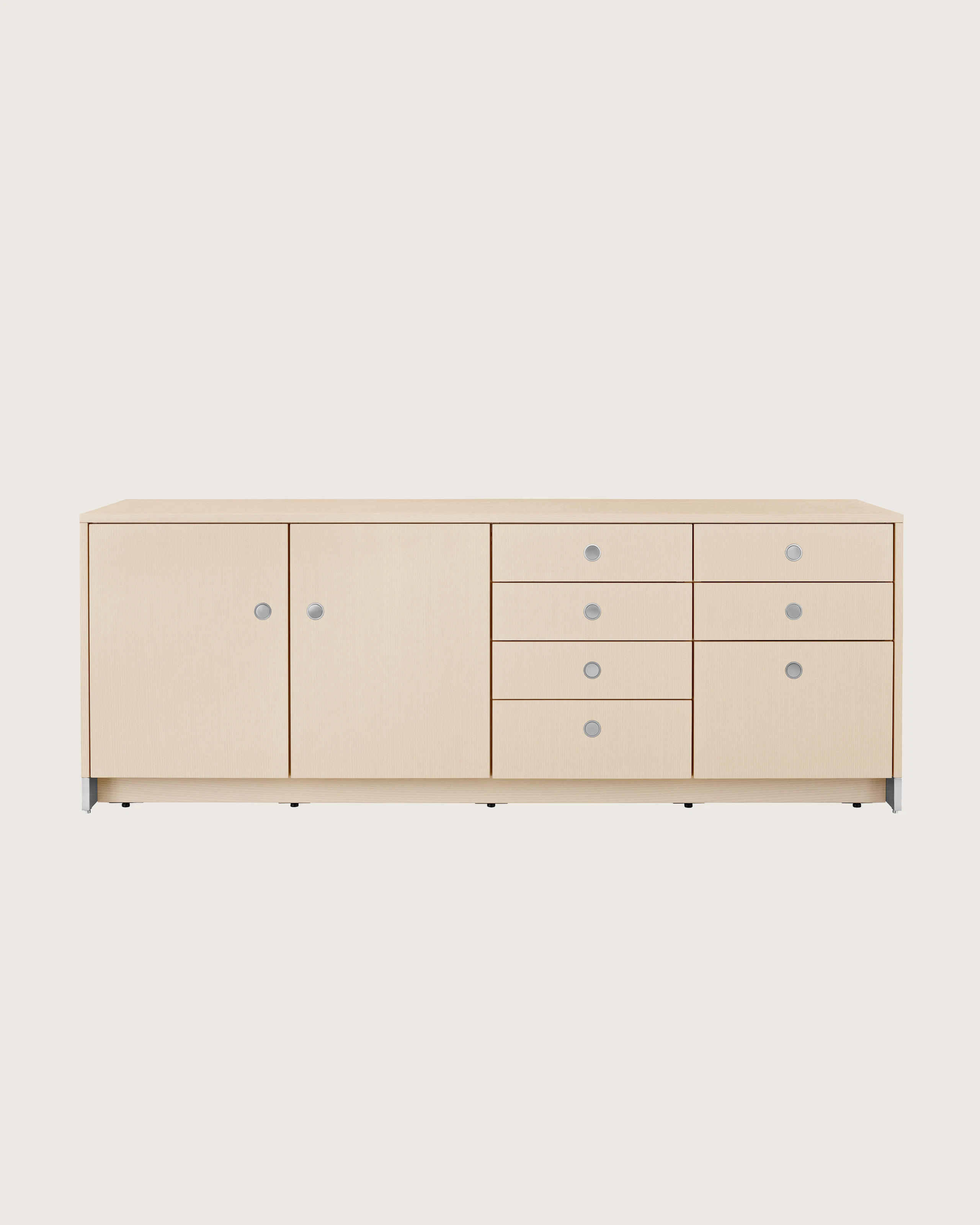 A four-unit Sled Base Storage credenza with a light wood finish and a combination of hinged doors, box drawers, and file storage.