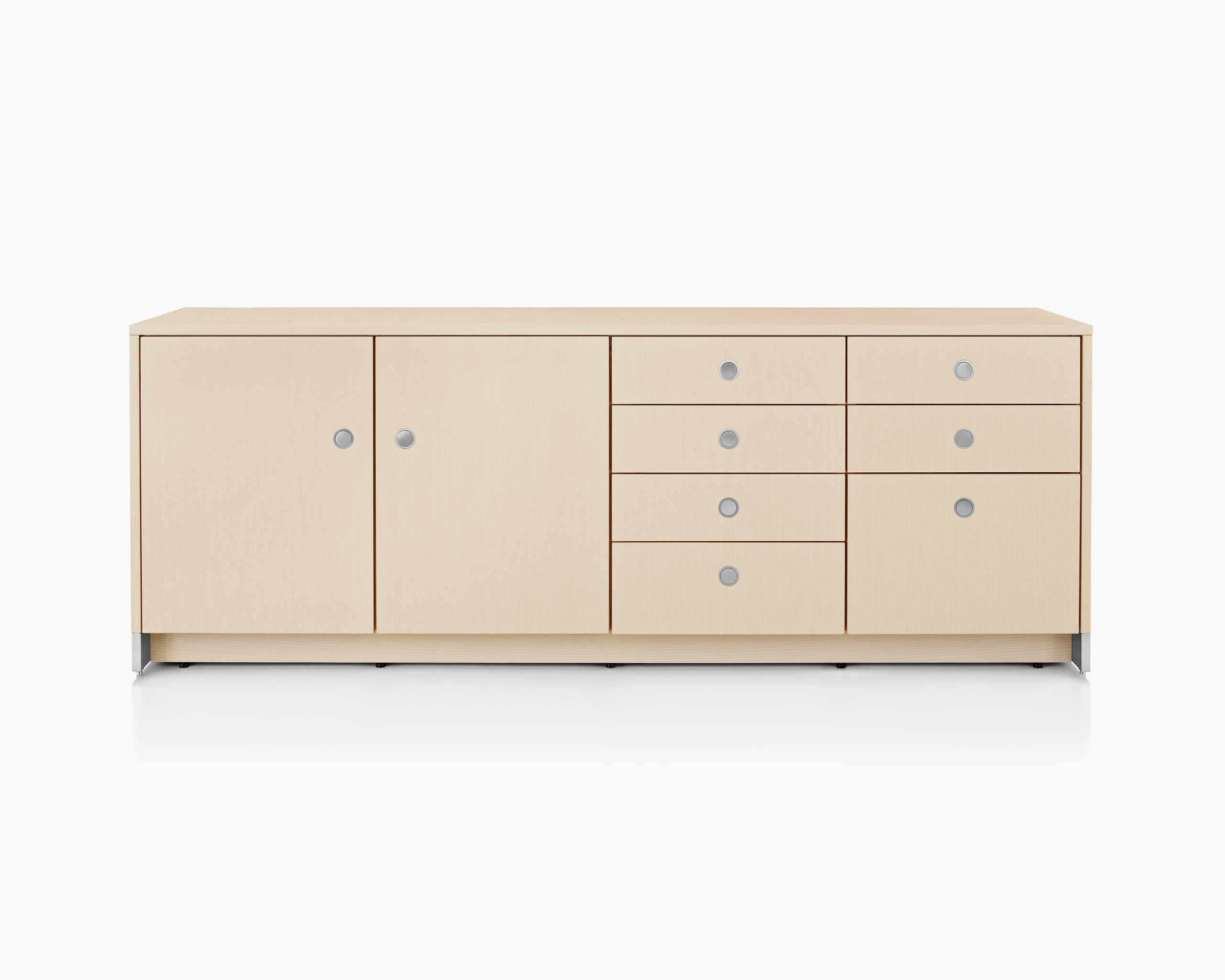 A four-unit Sled Base Storage credenza with a light wood finish and a combination of hinged doors, box drawers, and file storage.