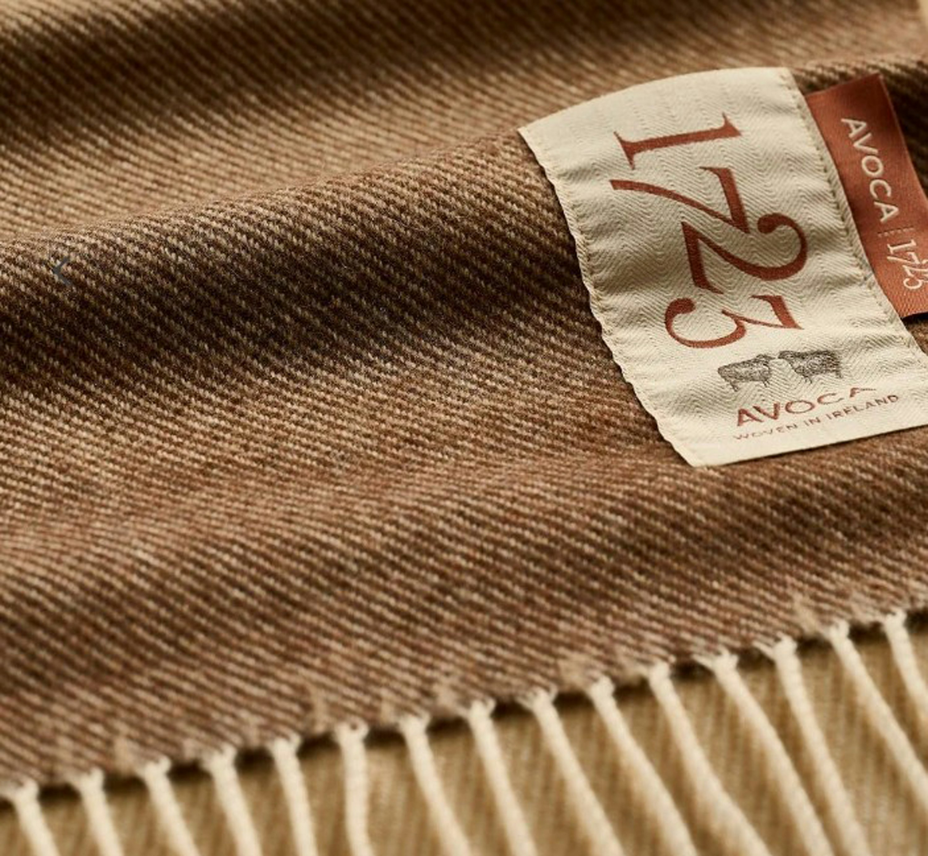 A detailed look at a Cashmere Throw in Ombre Camel.