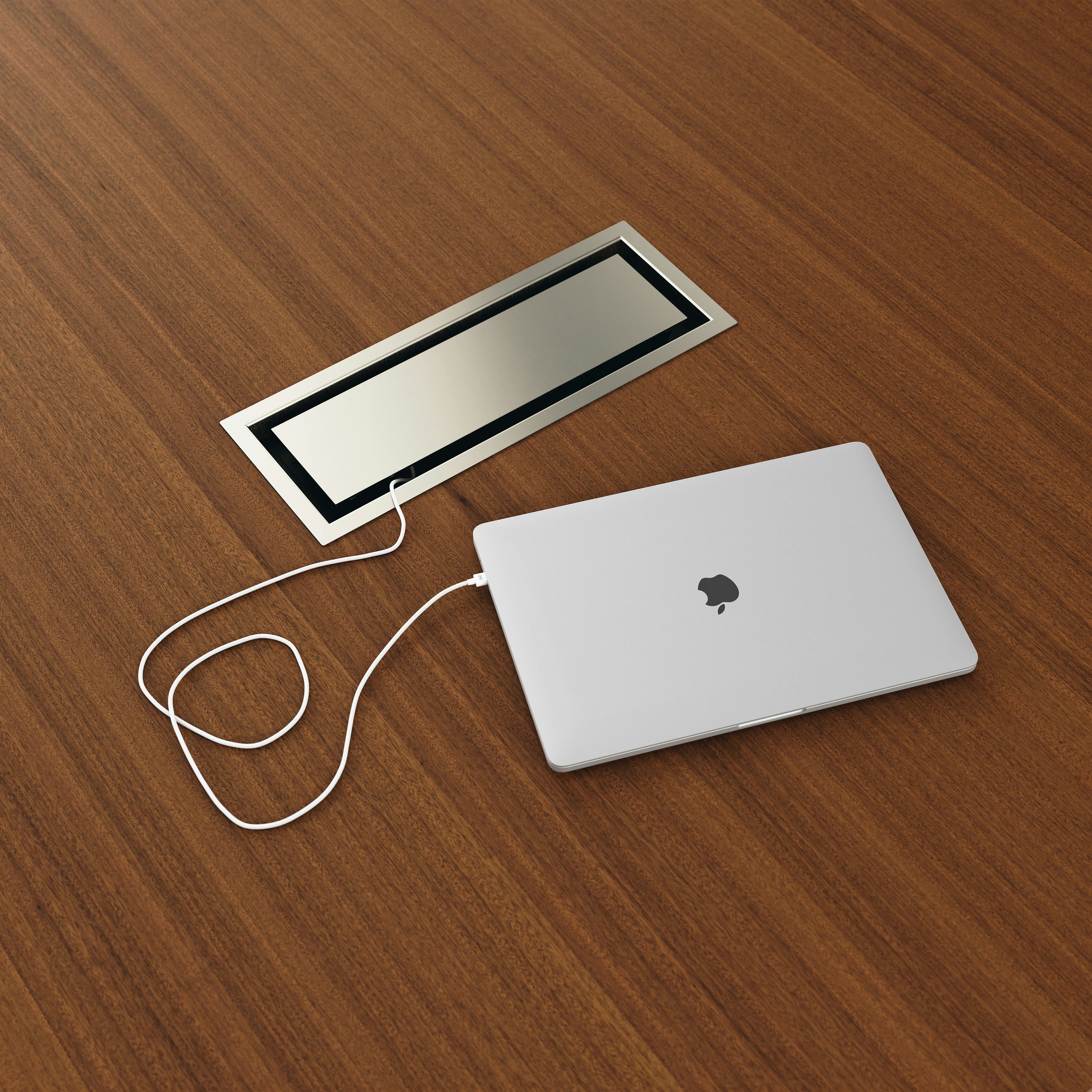 Detail shot of tabletop power access in Satin Nickel on a JD Media Table in Natural Quarter Cut Walnut. 