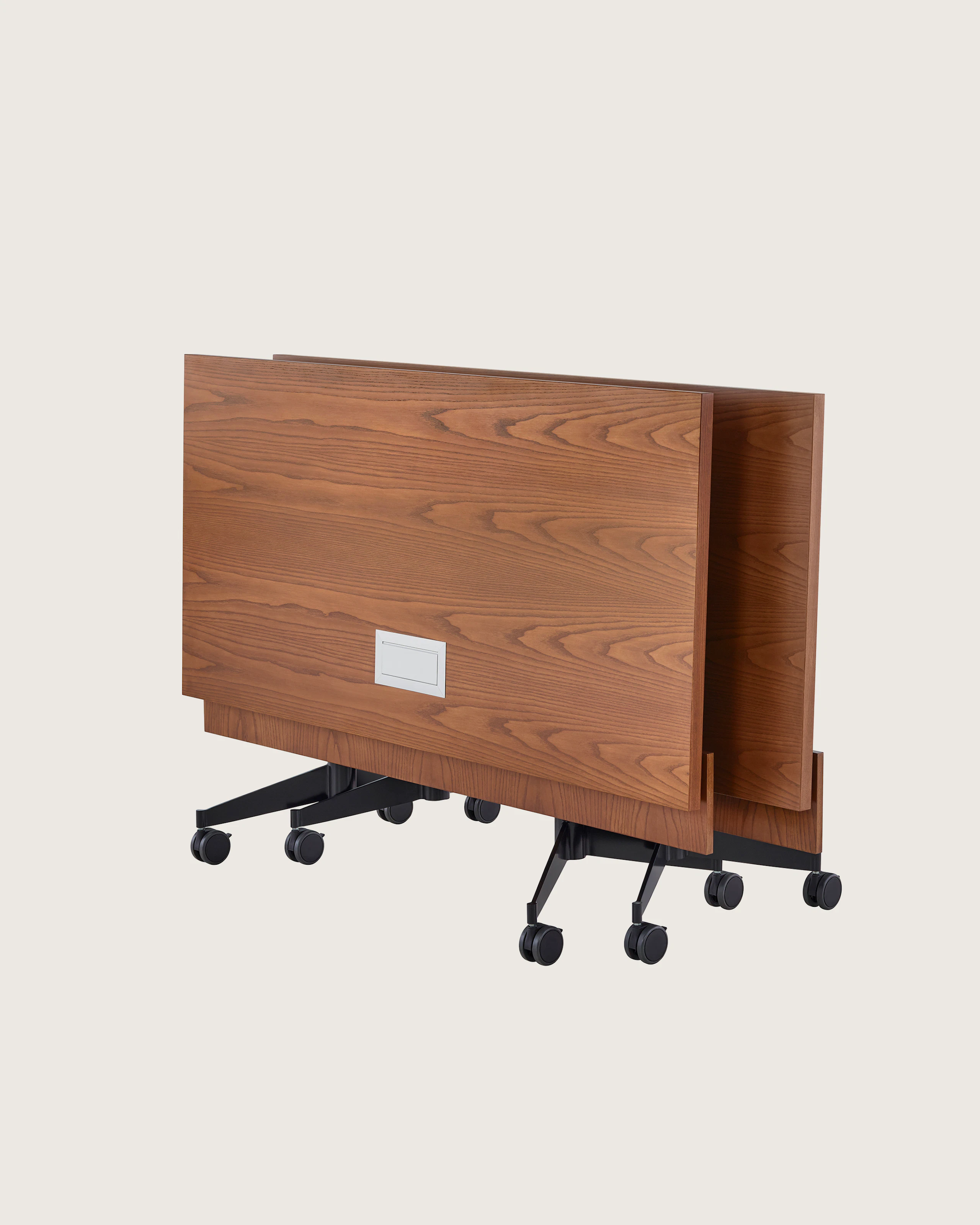 Two rectangular MP Flex Tables, folded upright and nested together.