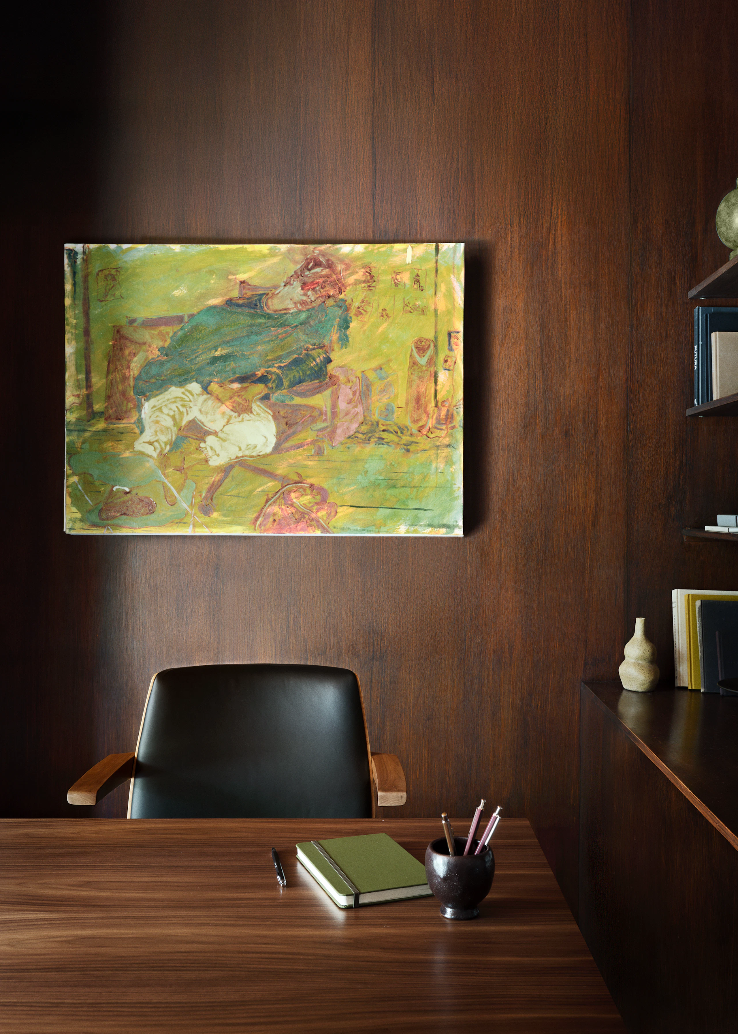 MP Table designed by Amir Paknya for Geiger in Natural Flat Cut Walnut shown with a Low-Back Clamshell Chair in an office setting.