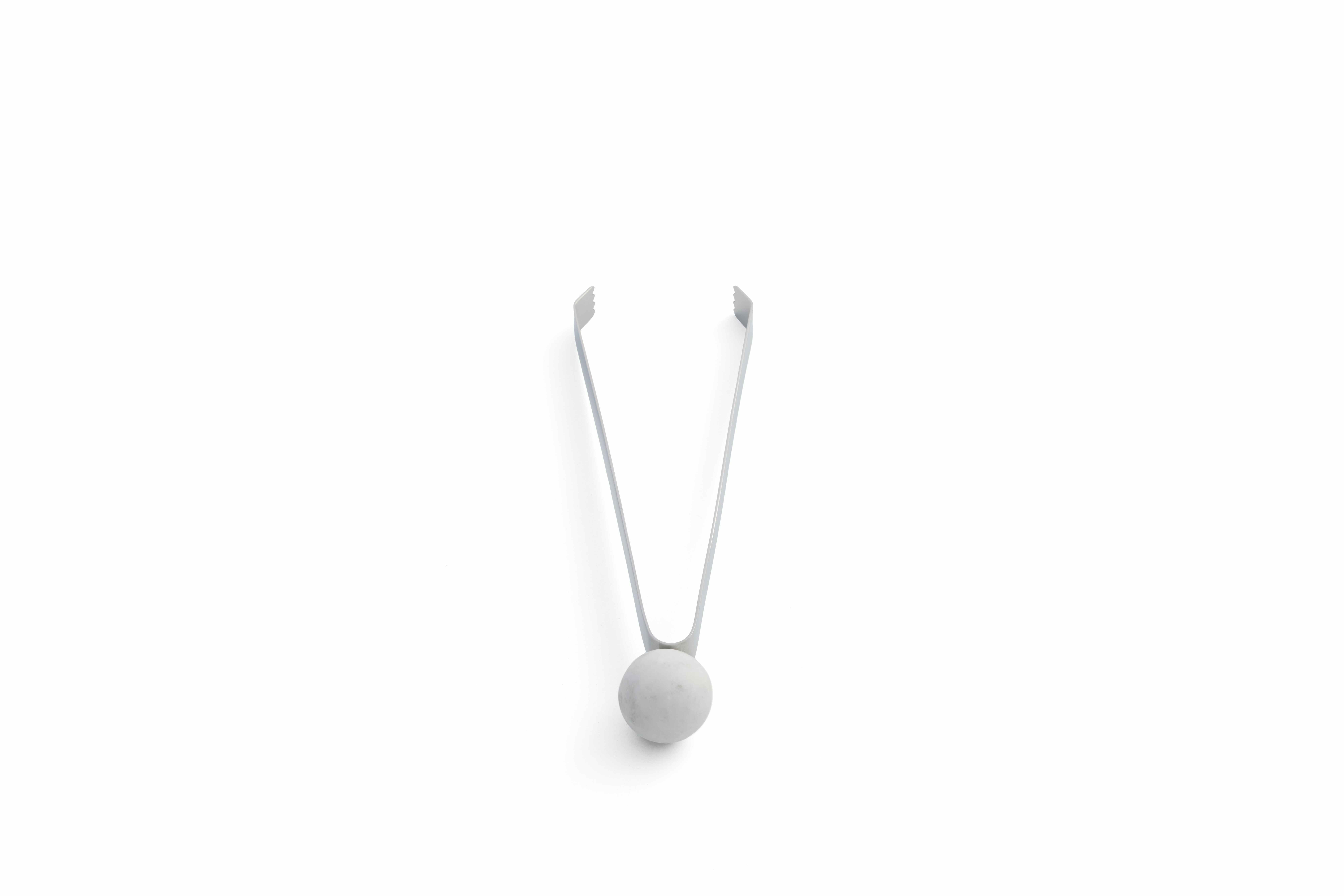 A Zoe Ice Tongs in Stainless Steel / Marble viewed from behind.