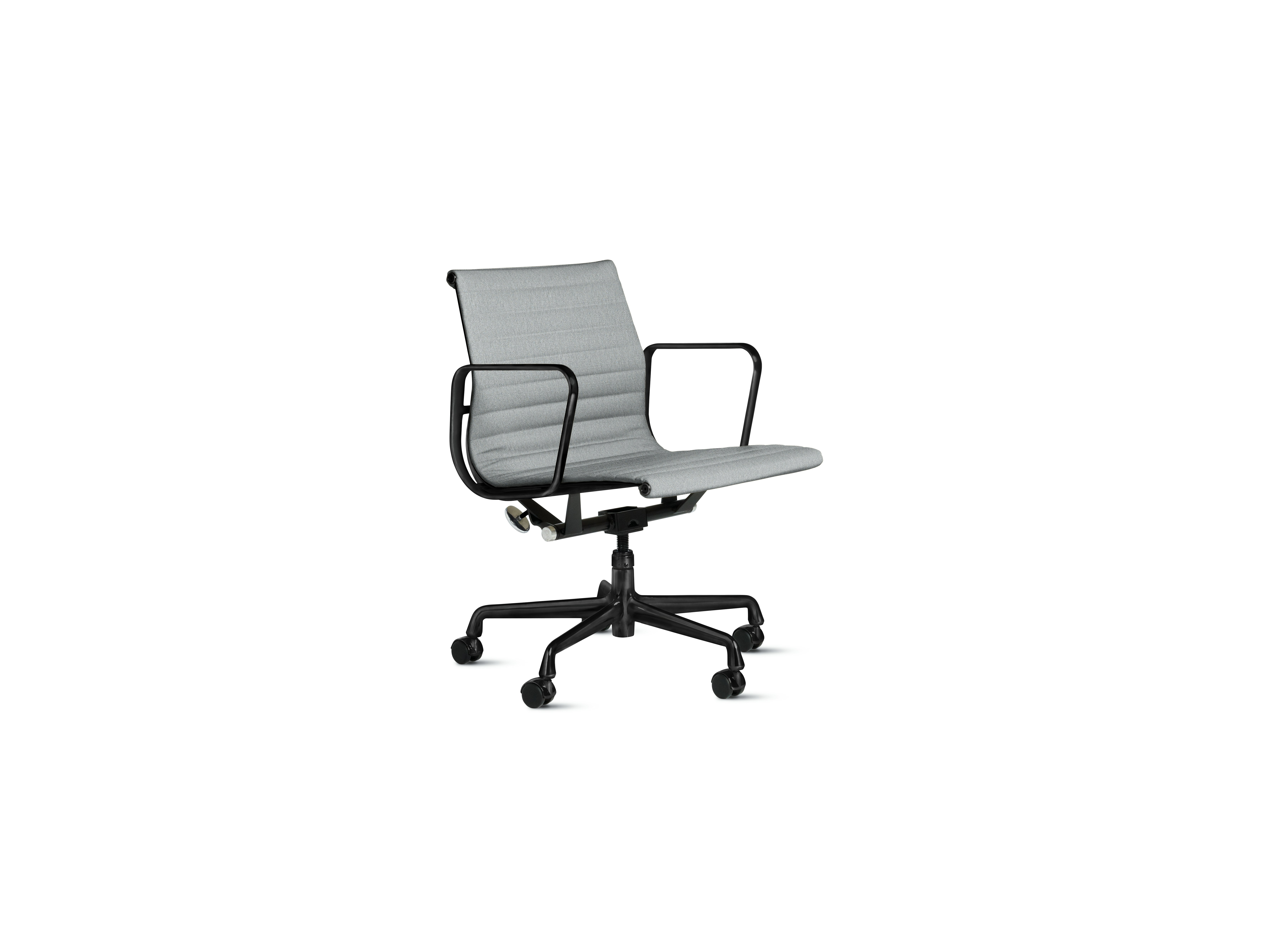A Eames Aluminum Group Chairs in powder and black viewed from an angle.
