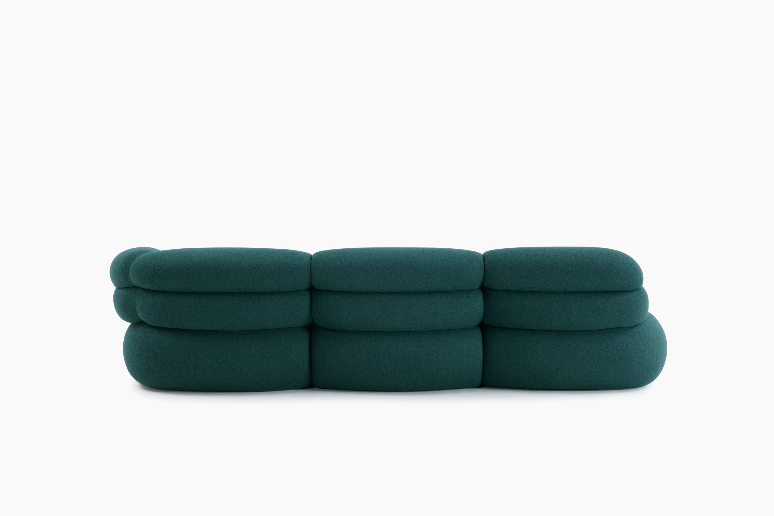 A Biboni Open End Sofa in Stellium, Midnight Teal viewed from behind.