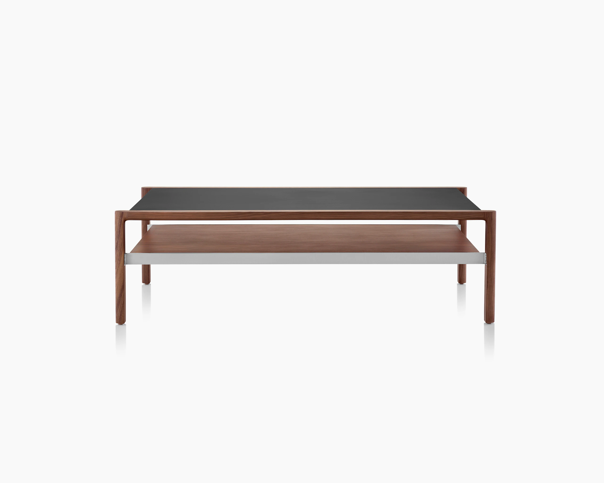 Partial front view of a rectangular Brabo coffee table with a black Bristol Leather-wrapped top, walnut lower shelf, and metal frame supports.