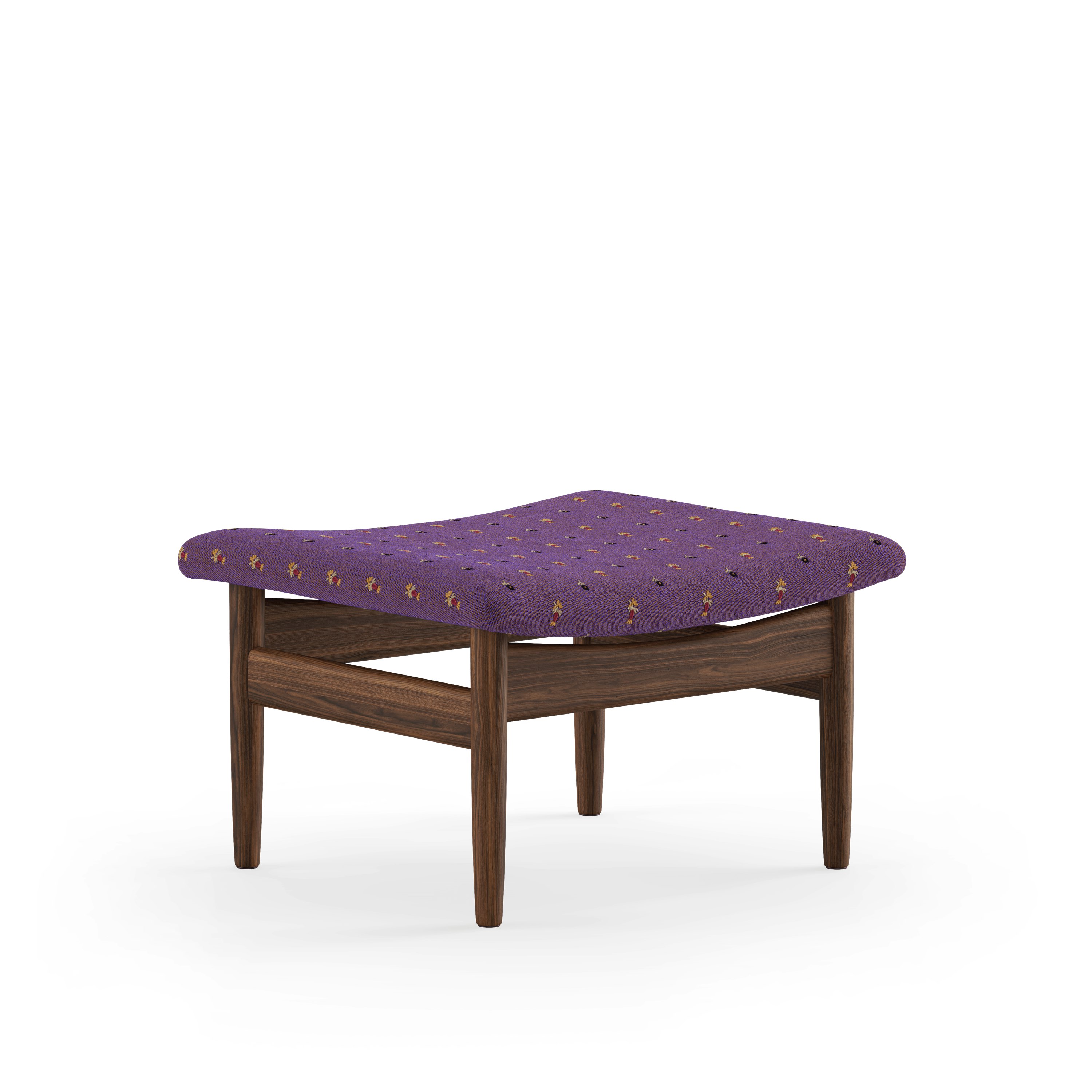 A Japan Footstool in Walnut viewed from an angle.
