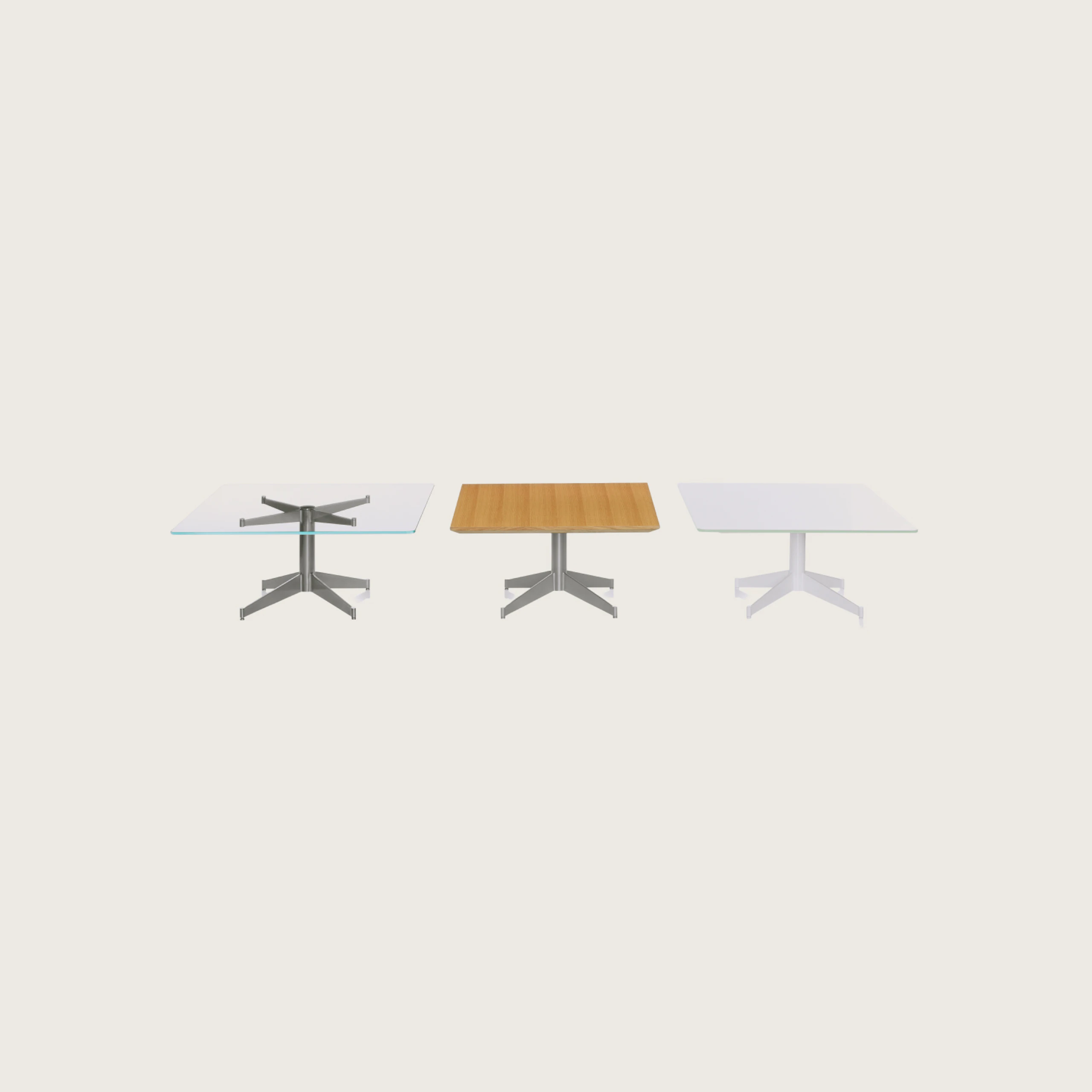 Three MP Tables arranged against a white background. Each table has a different top and base finish, but are all rectangular in shape.