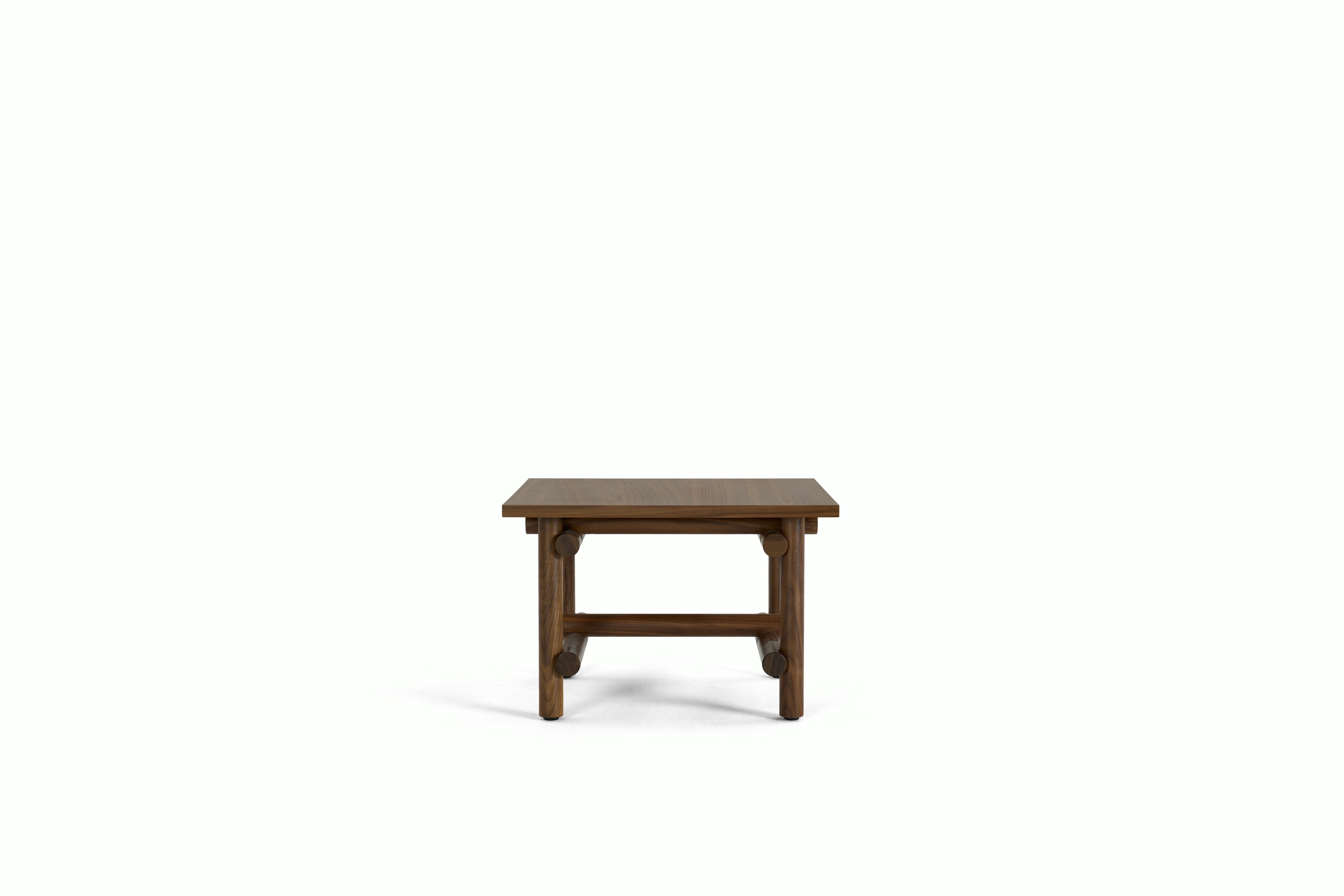 A Muecke Side Table in Walnut viewed from the front.