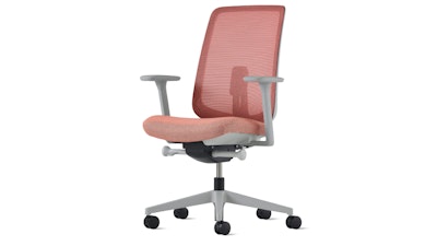 A front three-quarter view of a red Verus Chair by Herman Miller.