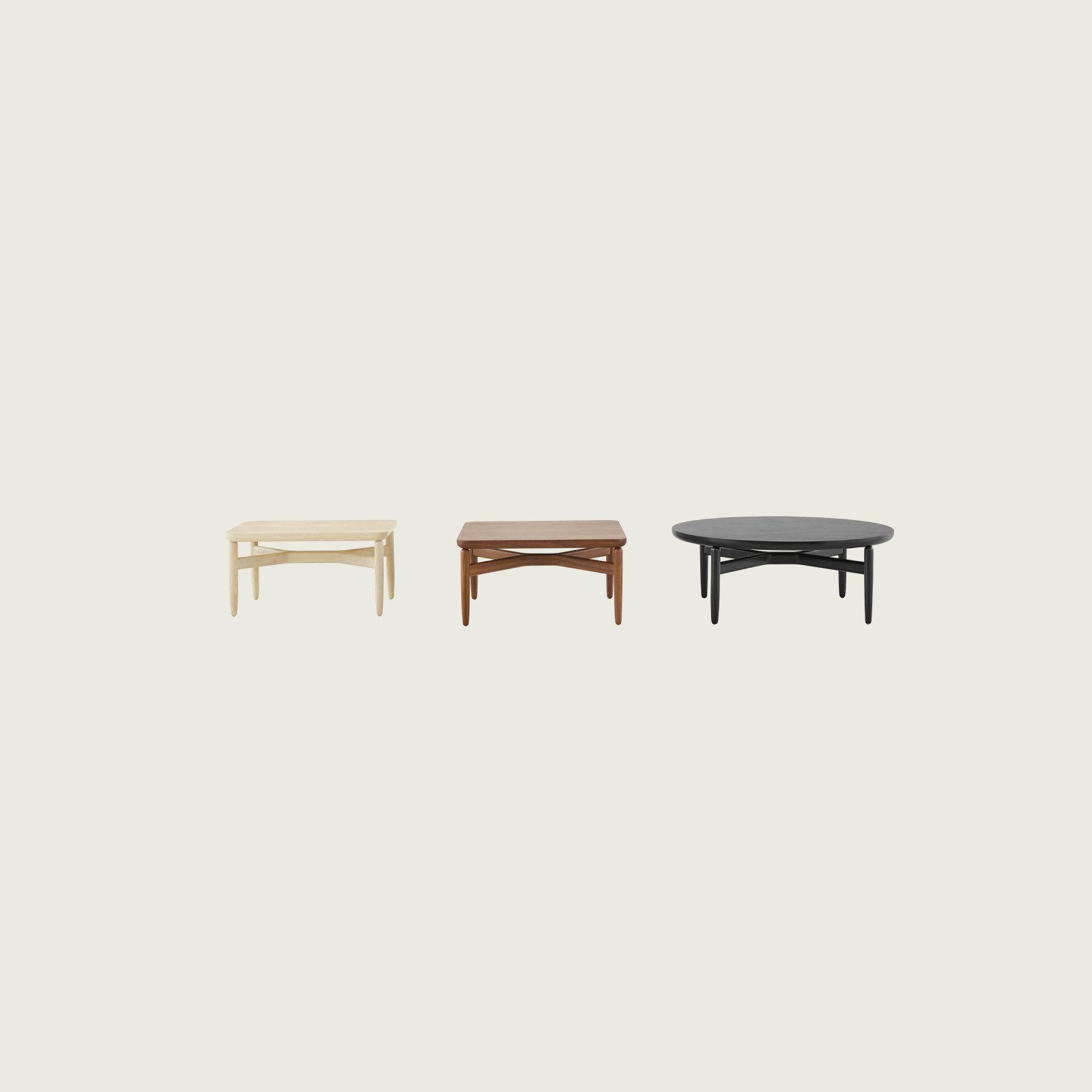 Three Reframe occasional tables with light, medium, and black finishes.