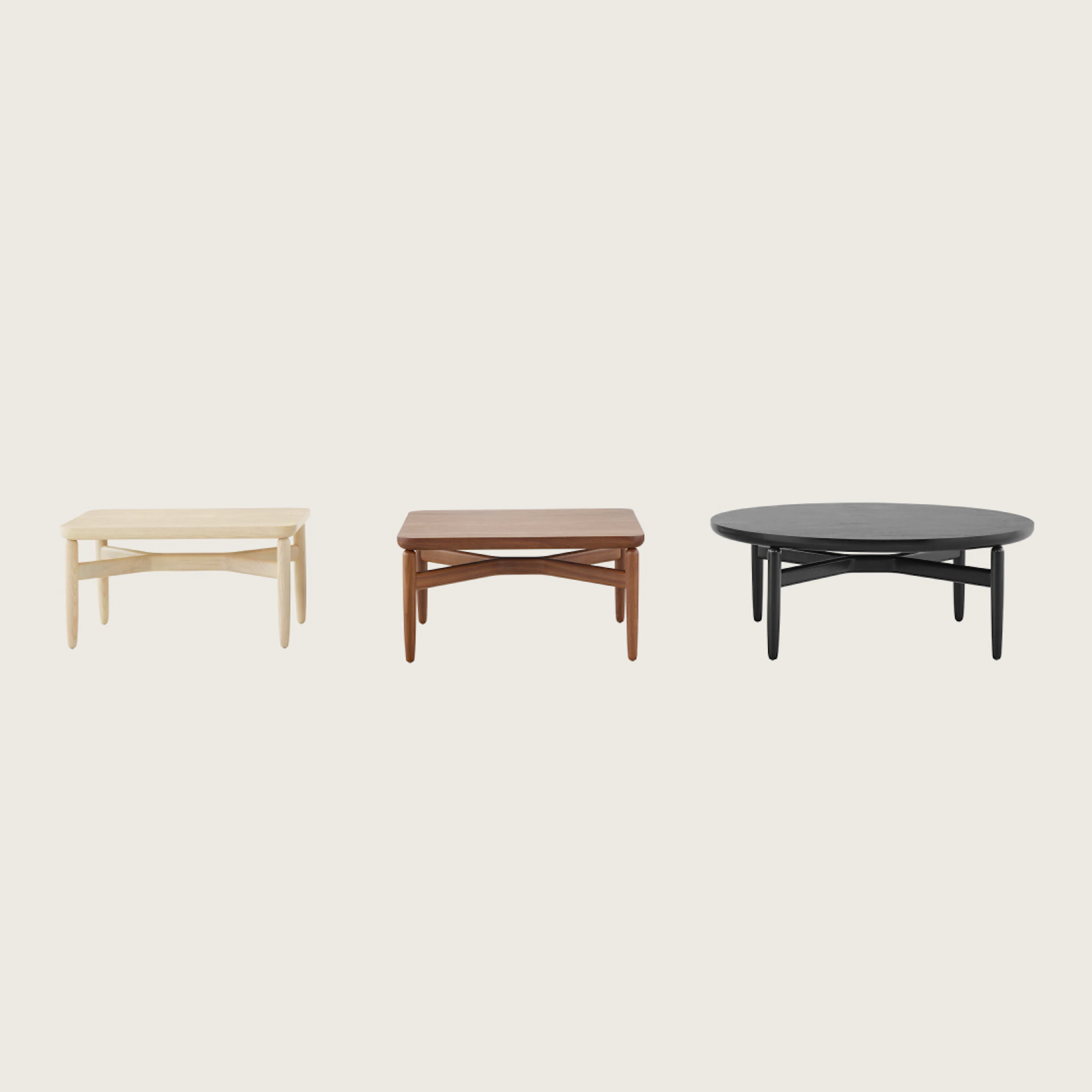 Three Reframe occasional tables with light, medium, and black finishes.
