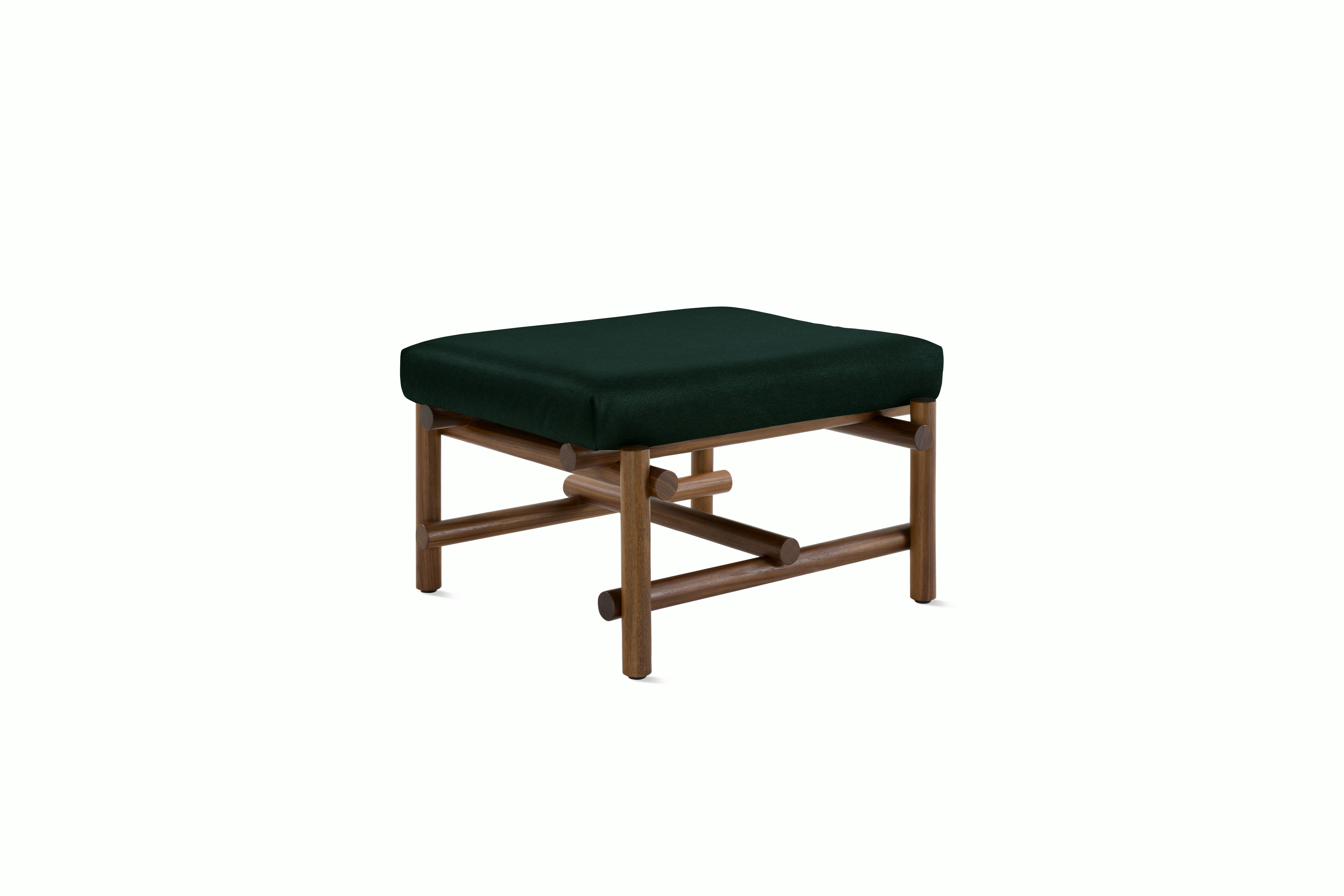 A Muecke Ottoman in Dark Green Walnut viewed from an angle.