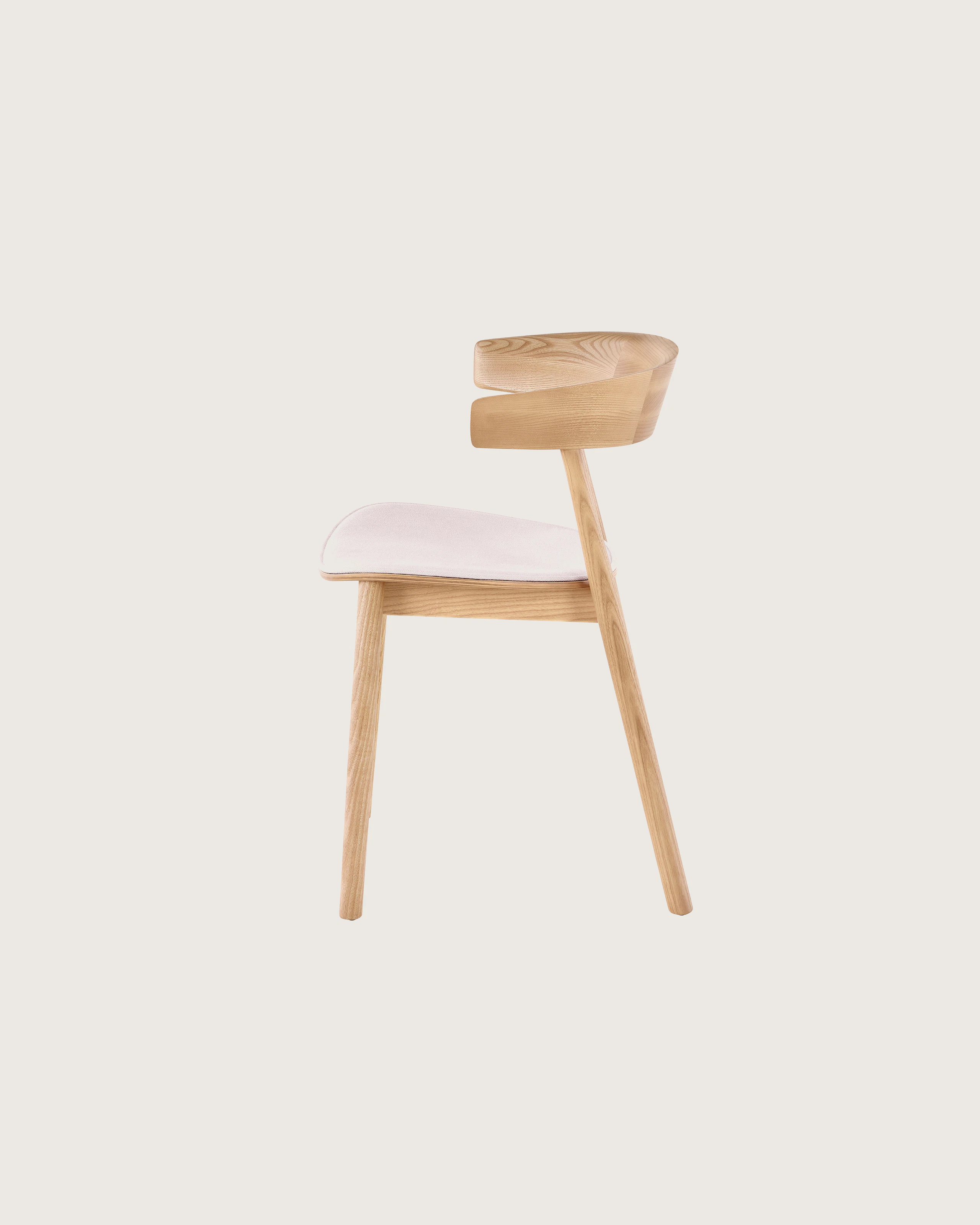 An oak colored Leeway Chair featuring a pink seat cushion.