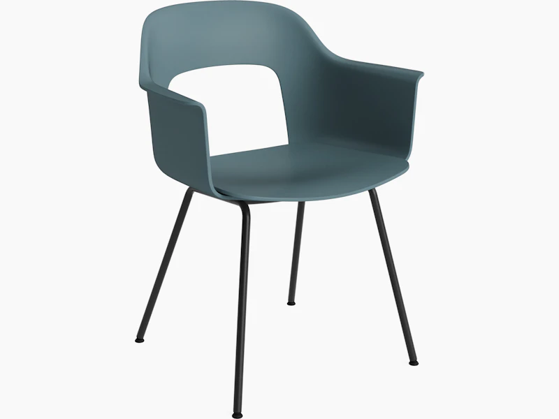 Plastic shell armchair on 4 metal legs, angled view