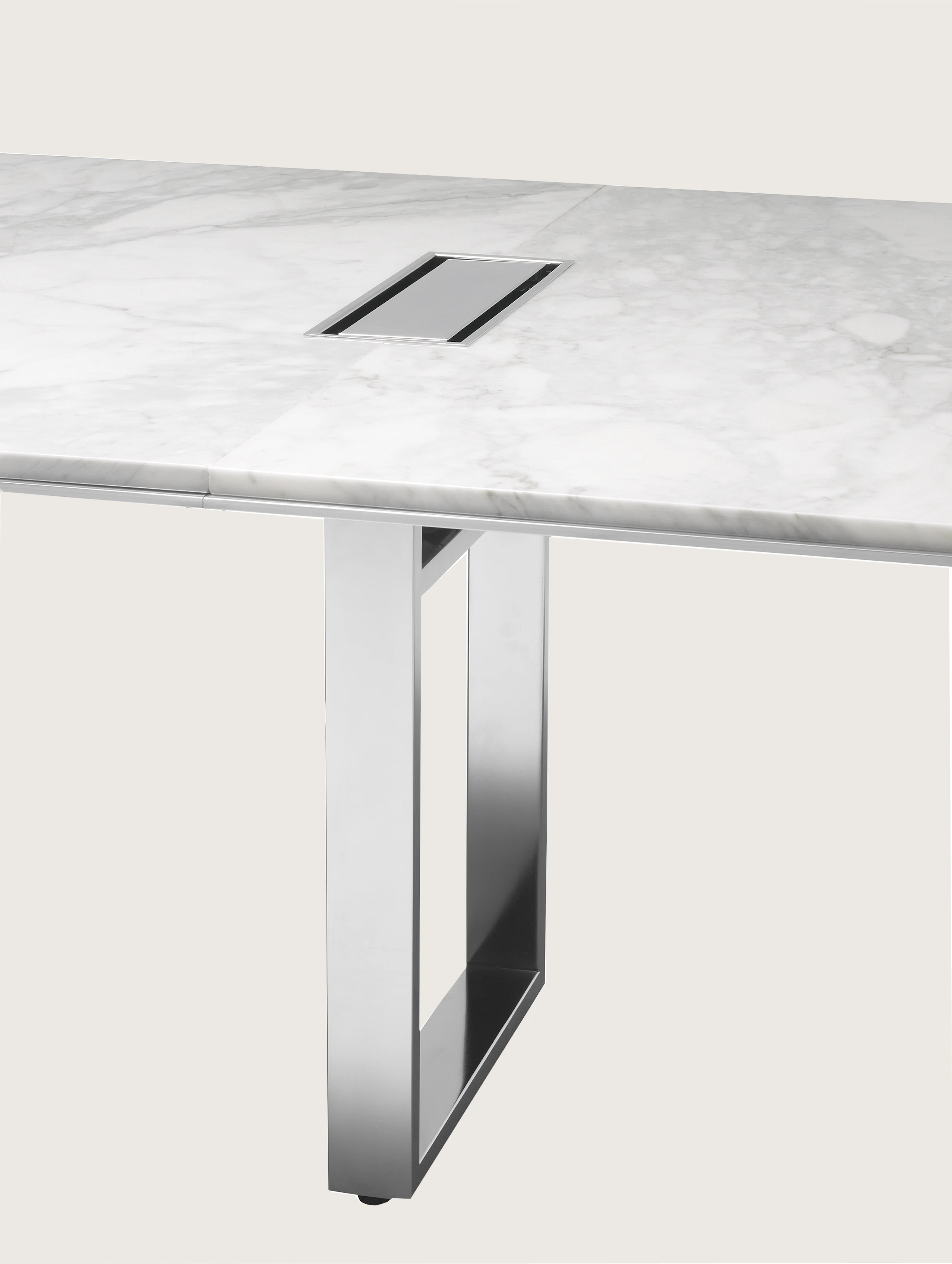 Highline Conference Table with White Carrara top, Polished Chrome base, Metal Edge detail, tabletop power, base detail view.