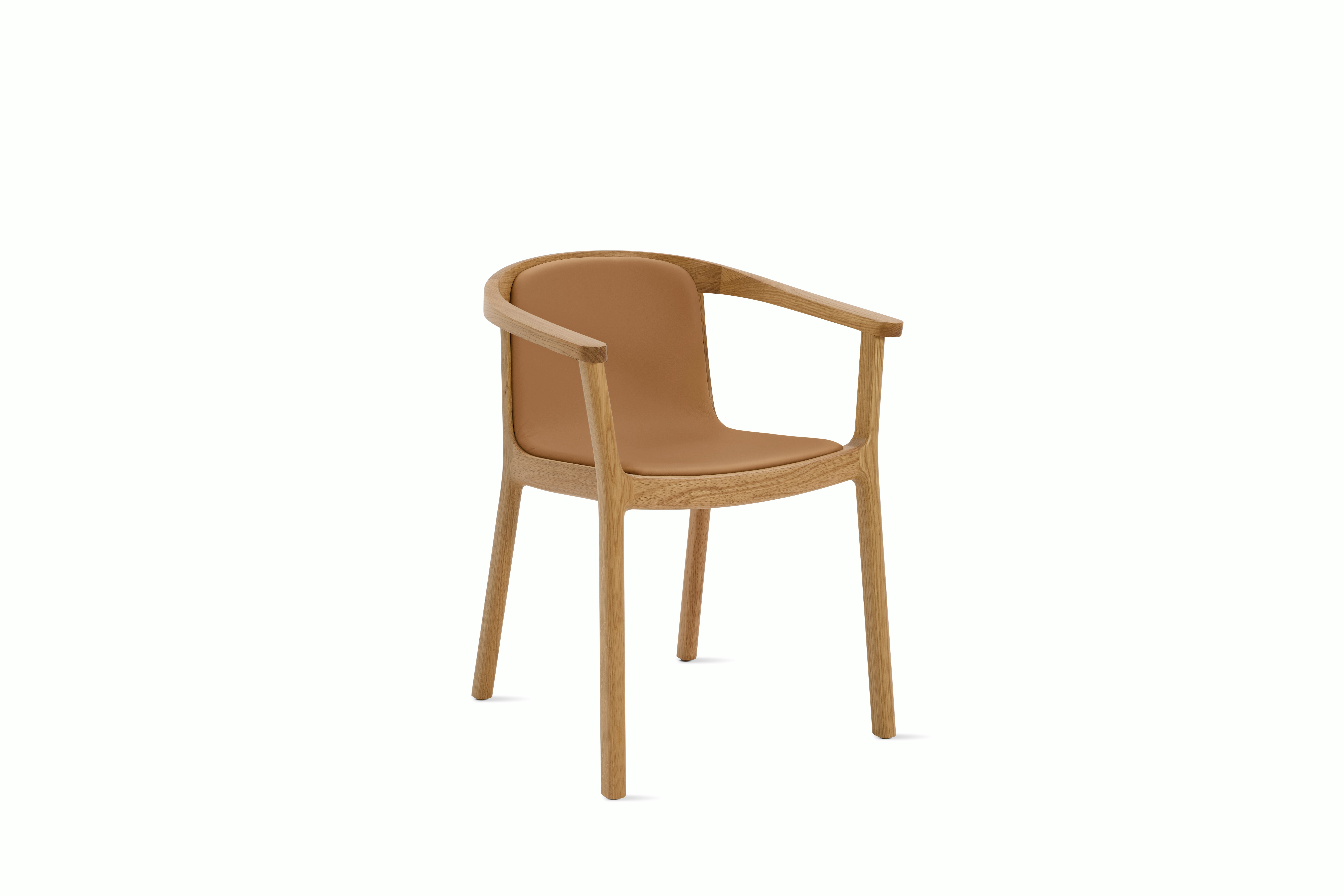 A Lijn Armchair in Bricolage Oak viewed from an angle.