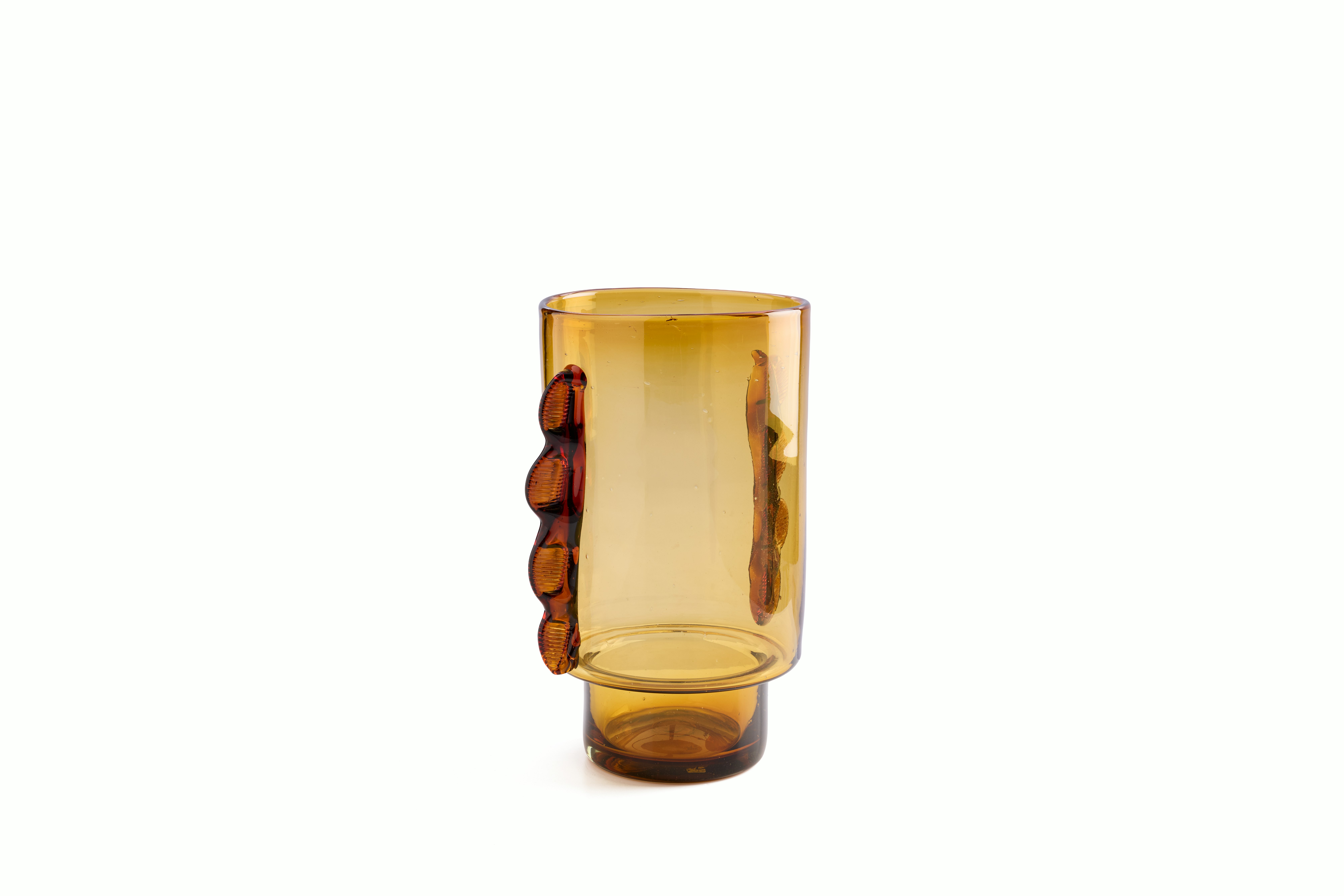 A Nora Vessel in Amber viewed from an angle.