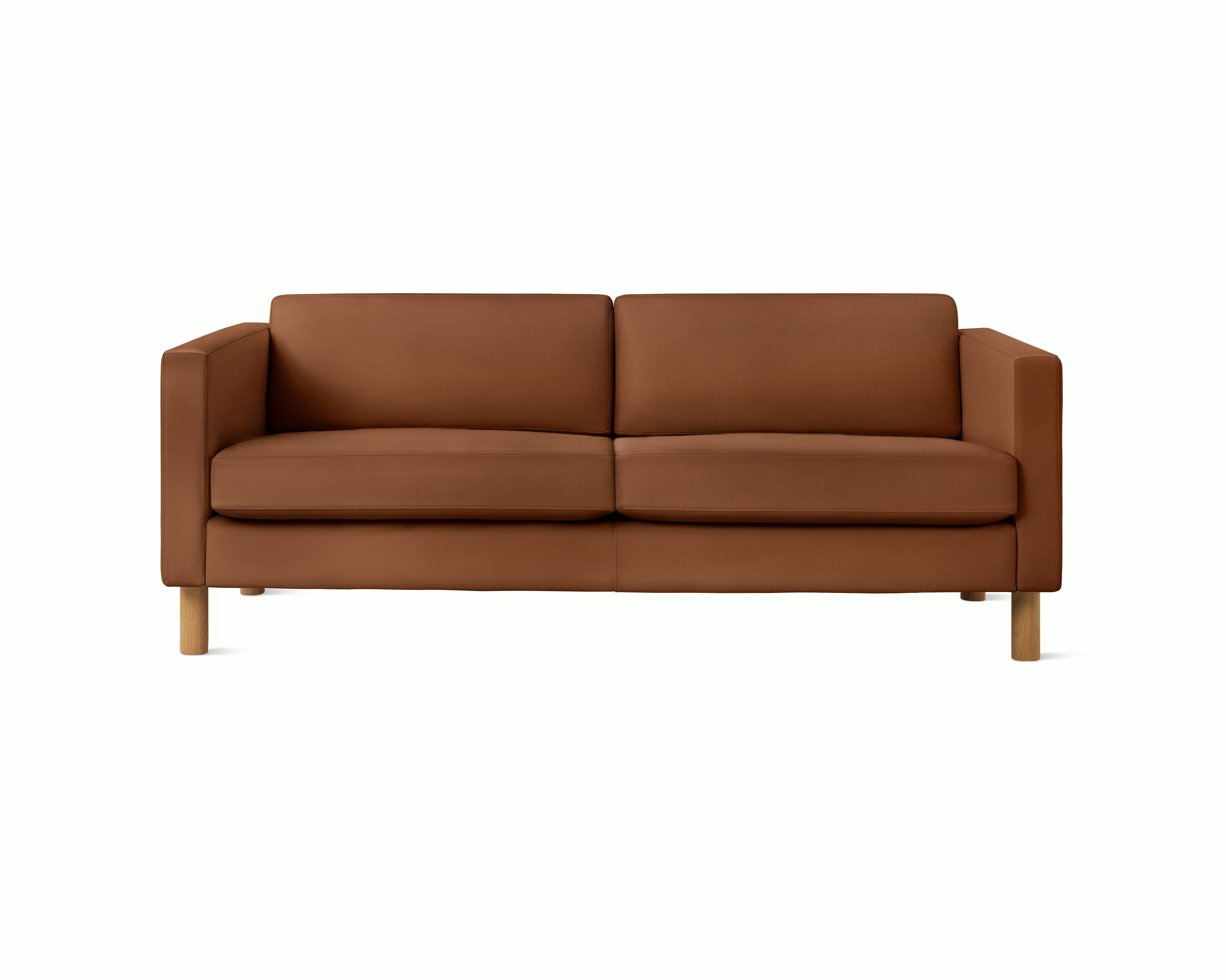 A Lispenard Sofa in Ledge upholstery with oak legs viewed from the front.