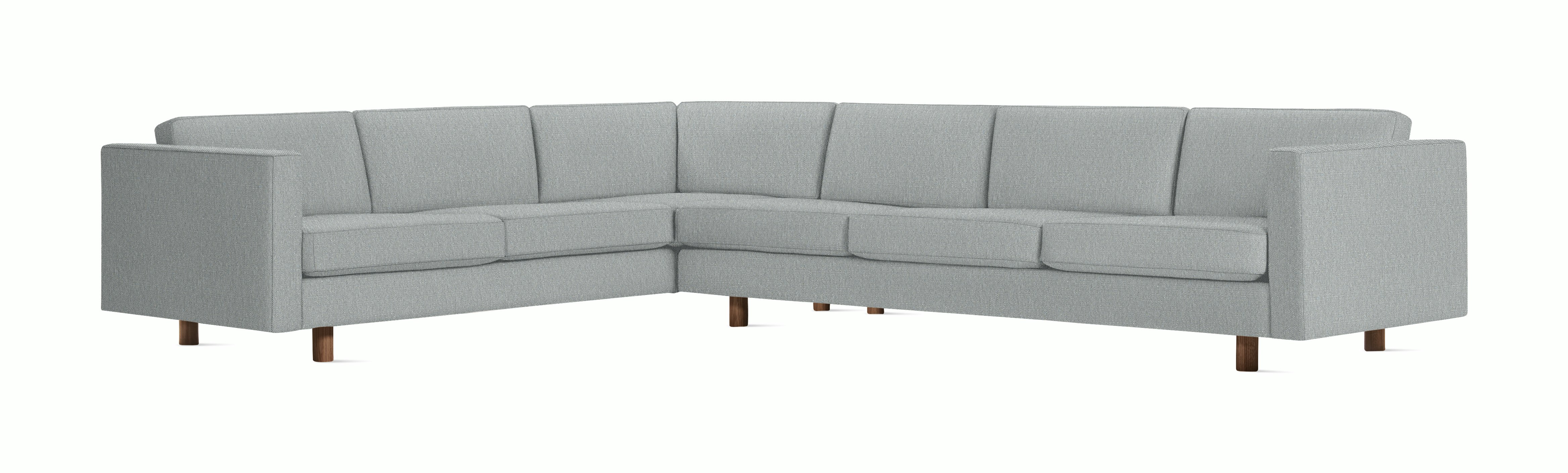 A Lispenard Corner Sectional in Powder with Walnut finish viewed from the front.