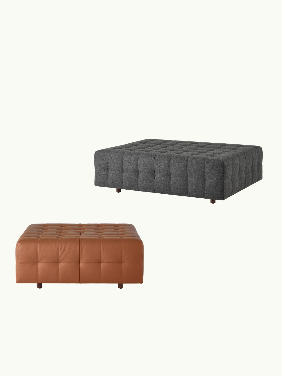 Two Rapport Ottomans designed by Isay Weinfeld, one front-facing small version upholstered with tan leather, one large version upholstered with a dark grey textile viewed at an angle and staggered above the other, on a white sweep.