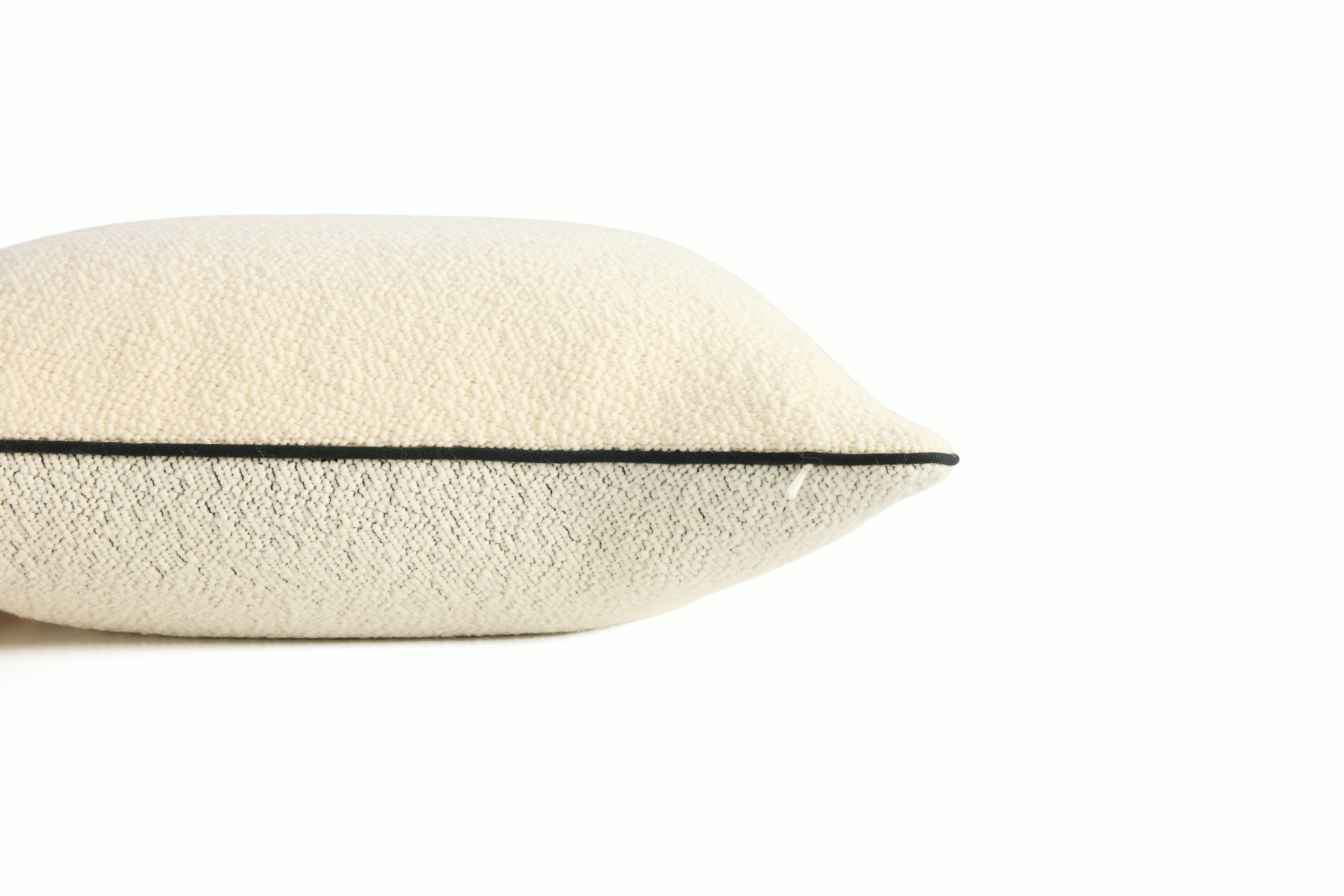 A detailed look at a Turf Color Blocked Pillow in Cream Melange Cream.