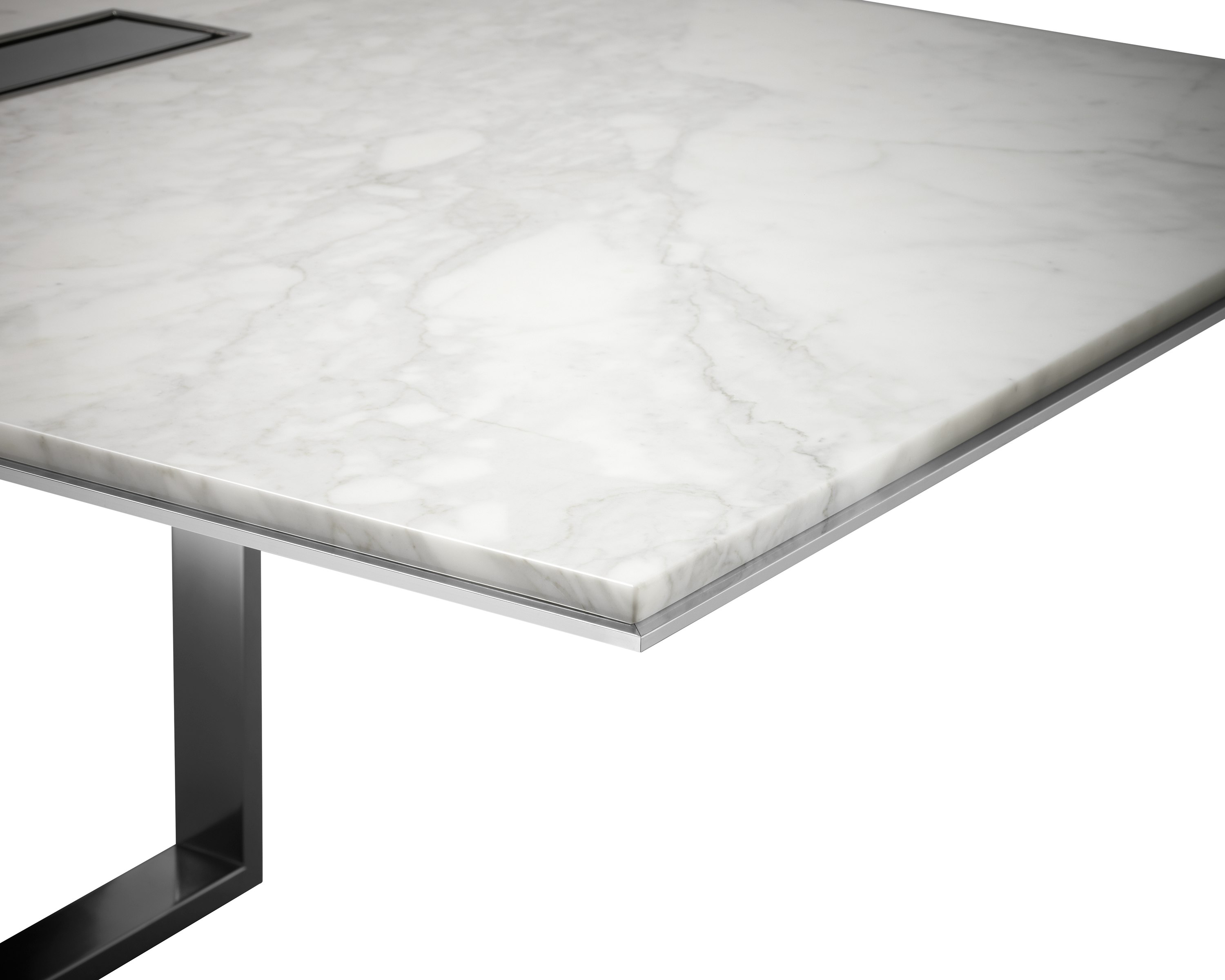Highline Conference Table with White Carrara top, Polished Chrome base, Metal Edge detail, tabletop power, corner detail view.
