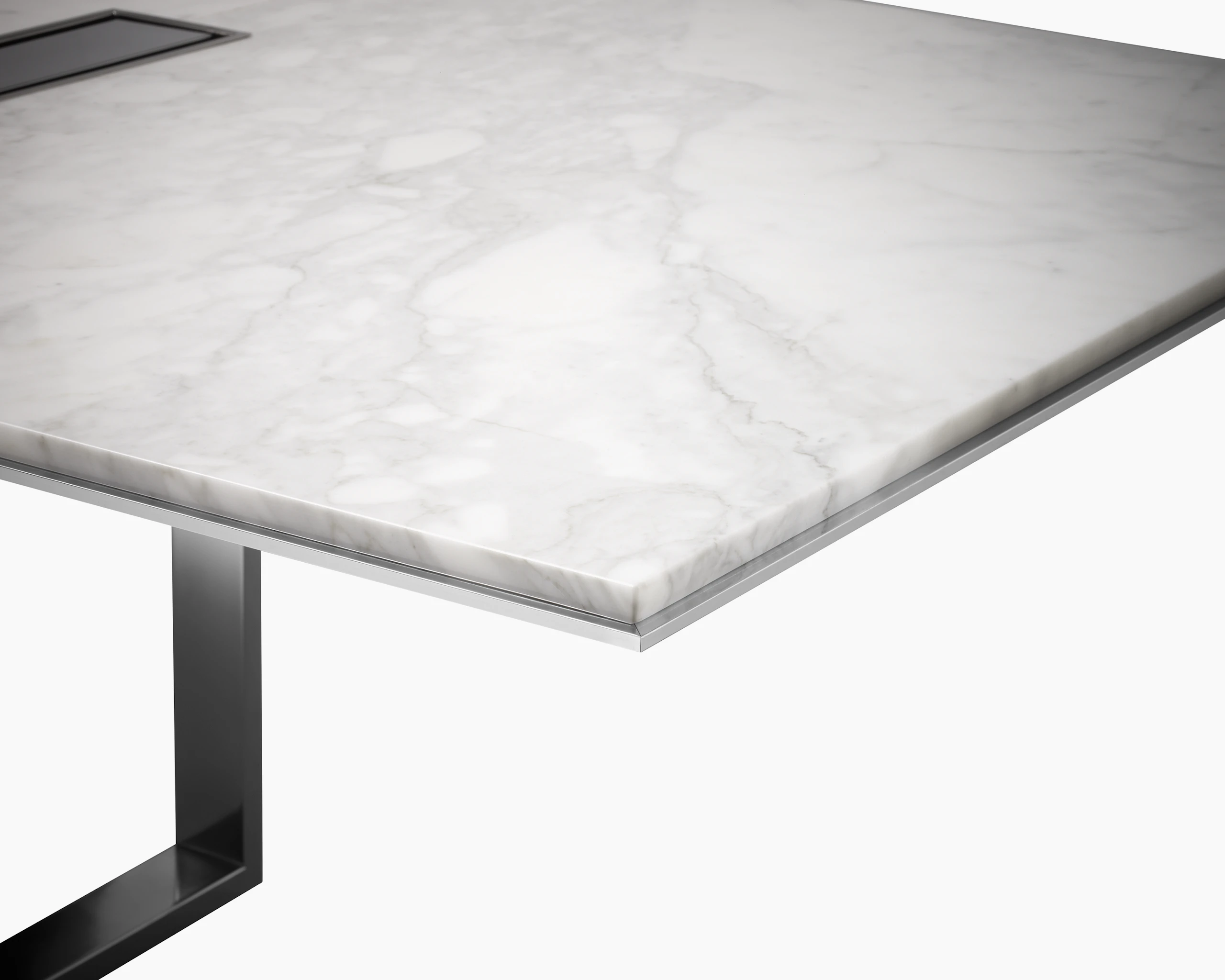 Highline Conference Table with White Carrara top, Polished Chrome base, Metal Edge detail, tabletop power, corner detail view.