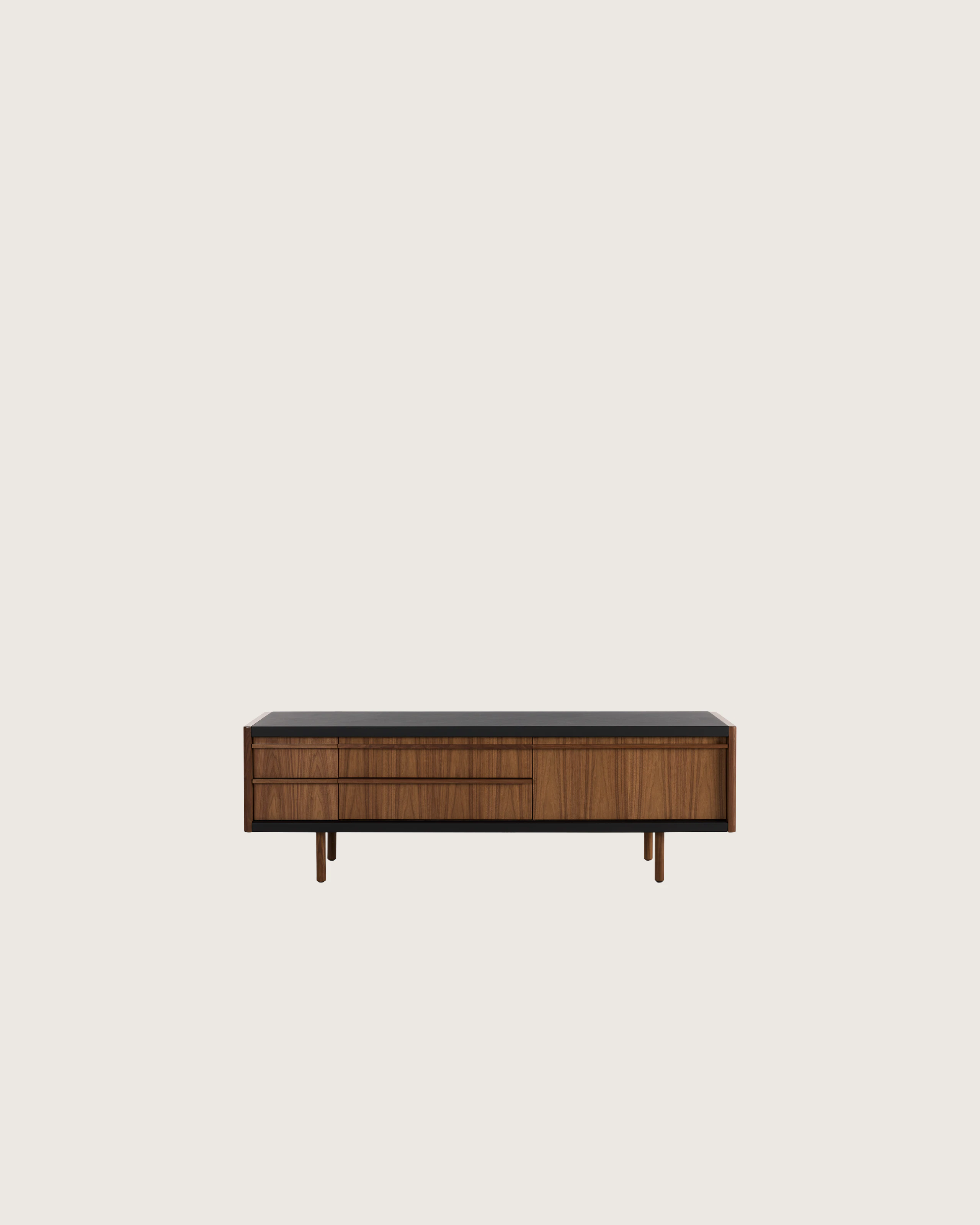 New Canaan Media Unit designed by BassamFellows for Geiger in Walnut with Black Leather shown in front view on a white sweep.