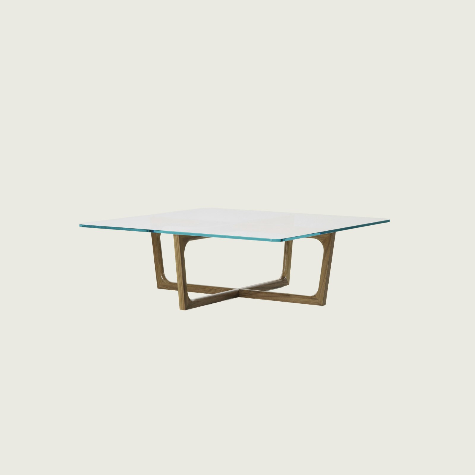 A square Loophole coffee table with a glass top and walnut base.