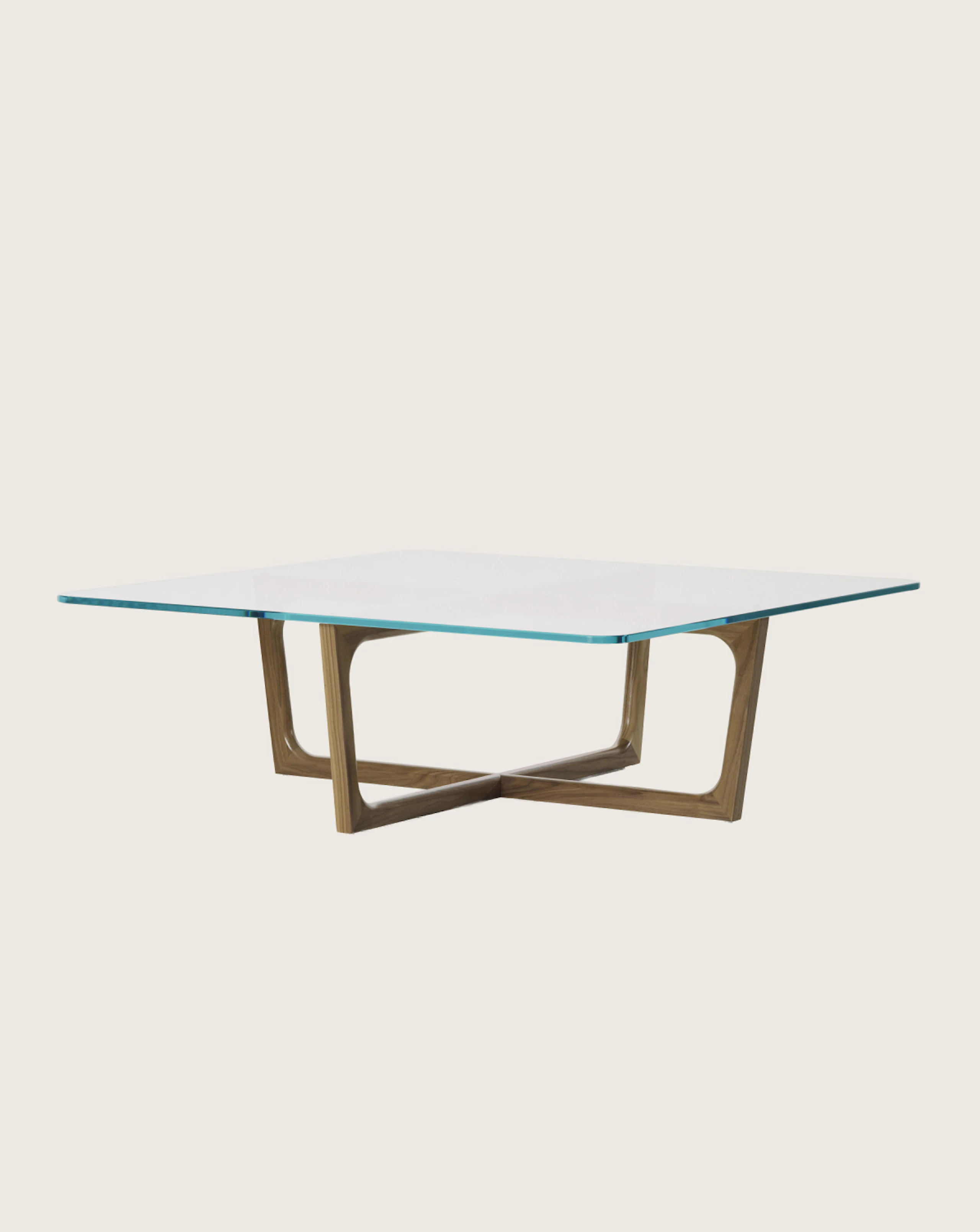 A square Loophole coffee table with a glass top and walnut base.