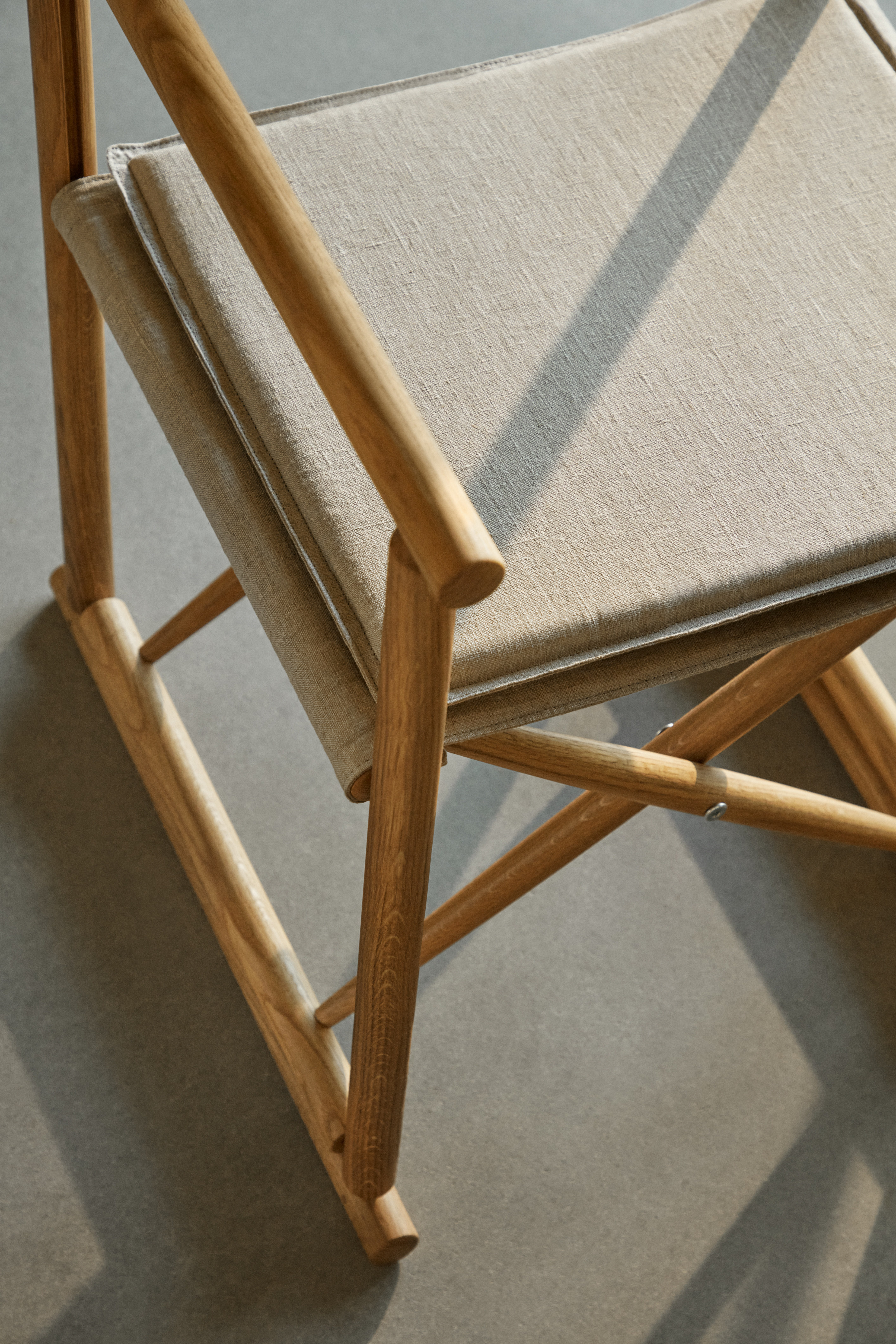 An Environmental shot of J138 Folding Chair in Oiled Oak.