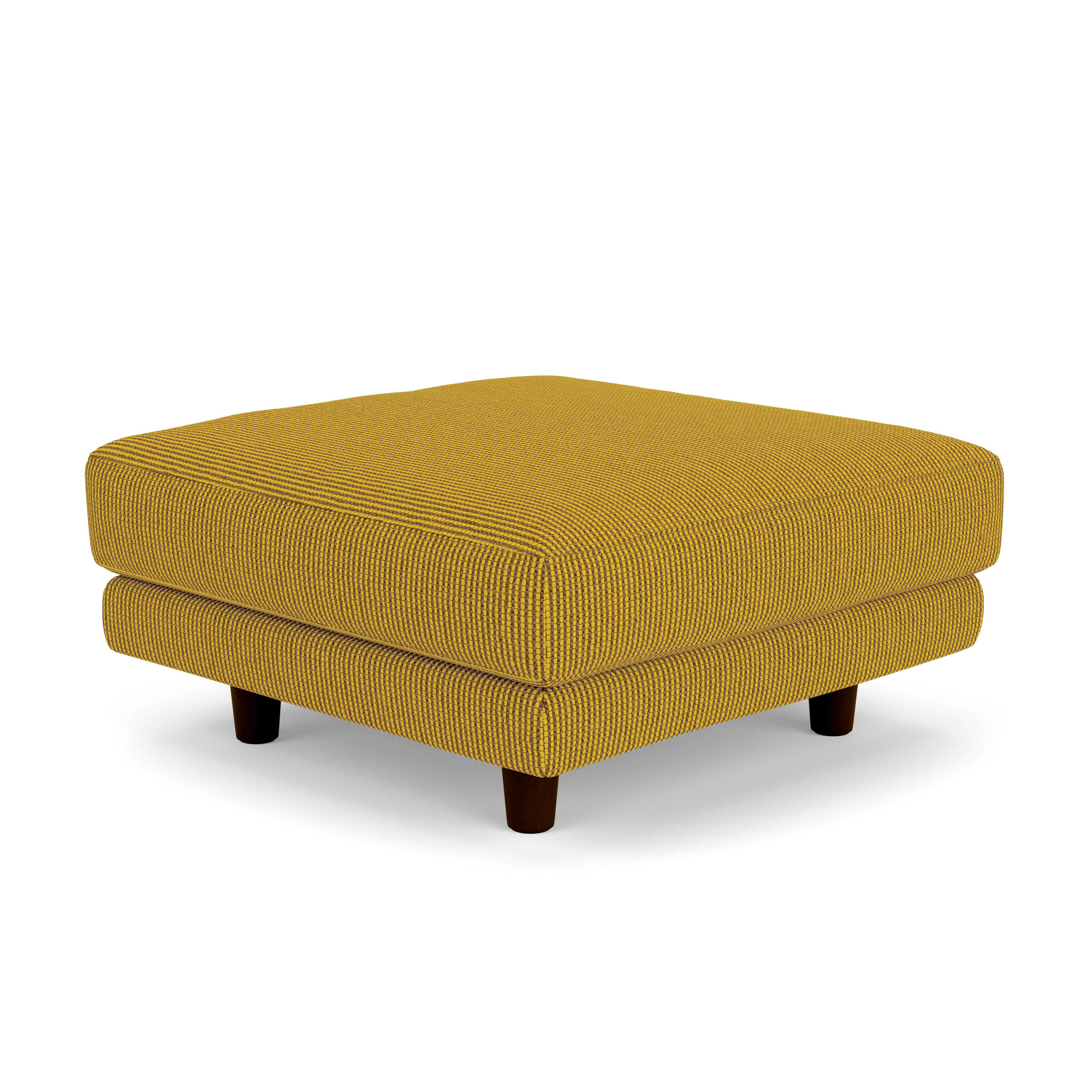 A D'Urso Ottoman in Cadmium Burnt Walnut on Oak viewed from an angle.