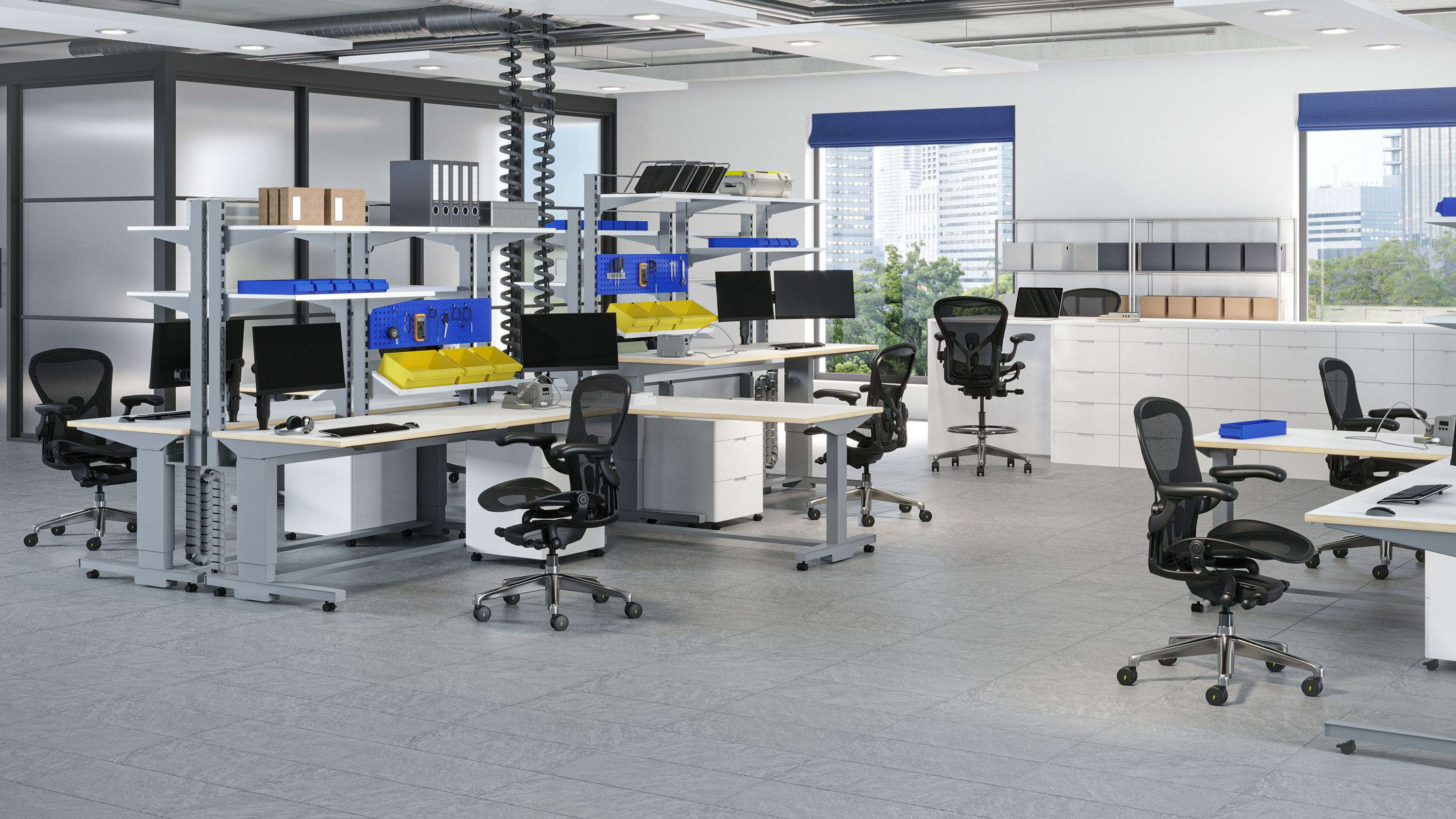 Aeron ESD Chairs and Stools in a traditional manufacturing space with dedicated workstations for electronics assembly.