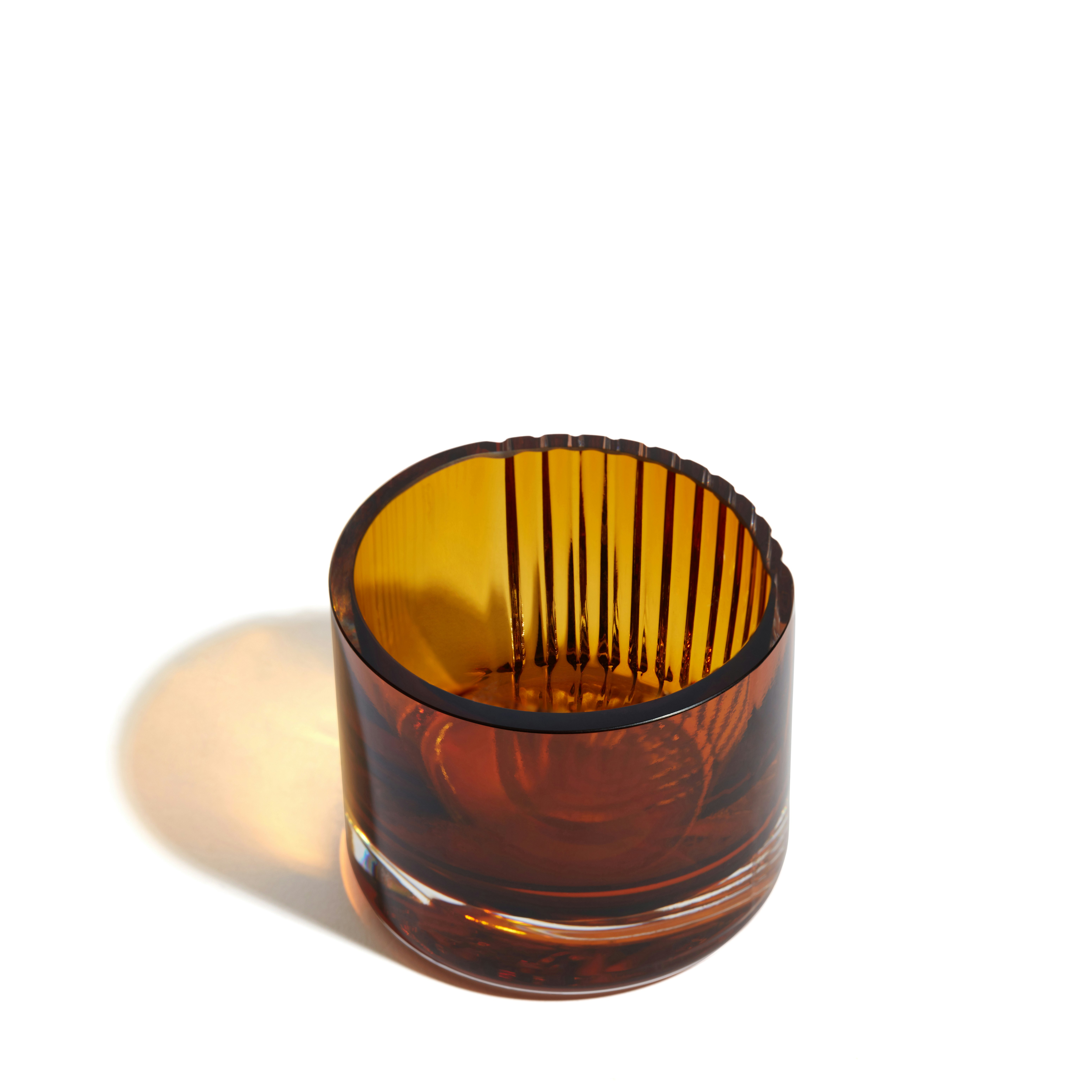 A Pulse Tealight Holder in Amber viewed from the front.