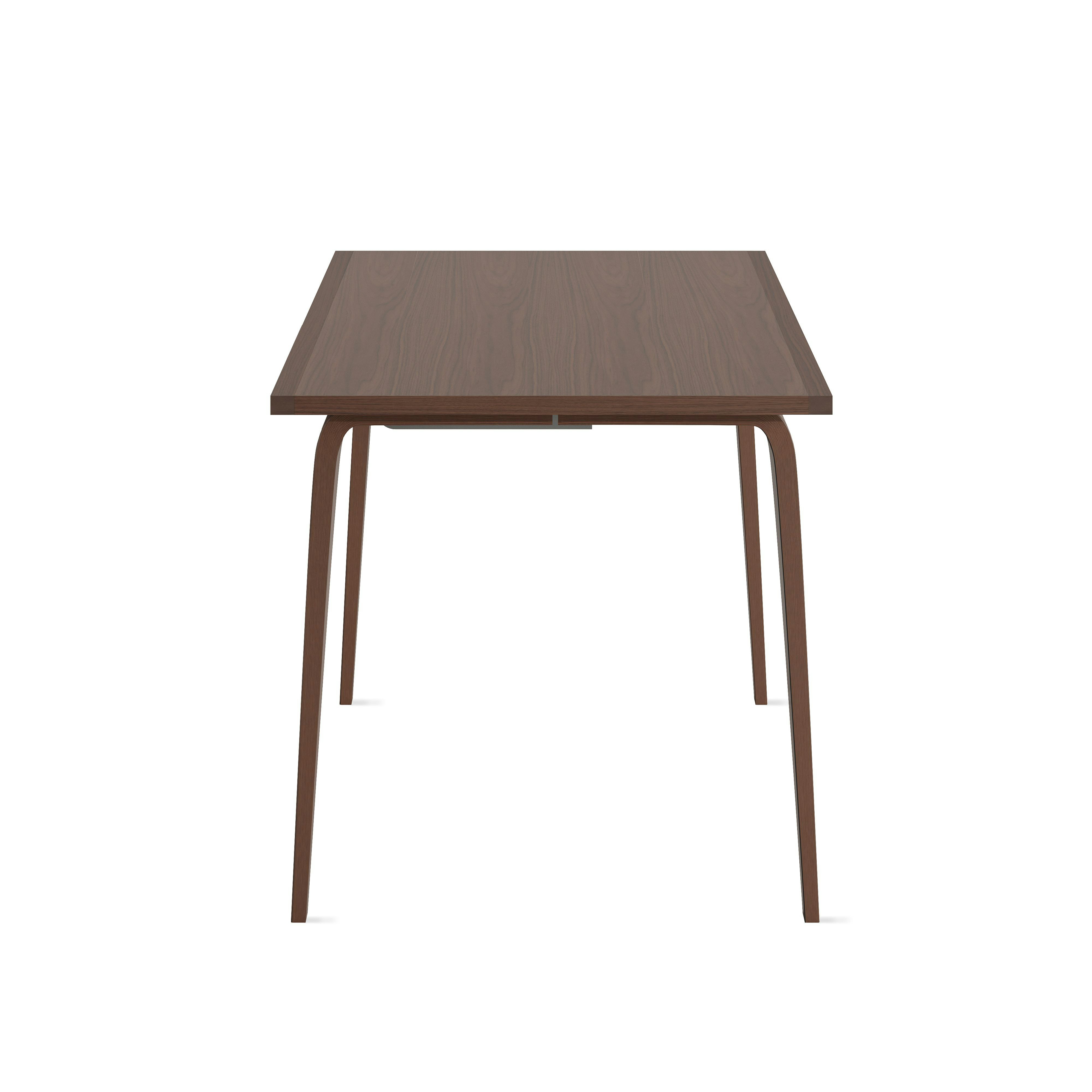 A Cherner Studio Desk in Natural walnut viewed from the front.