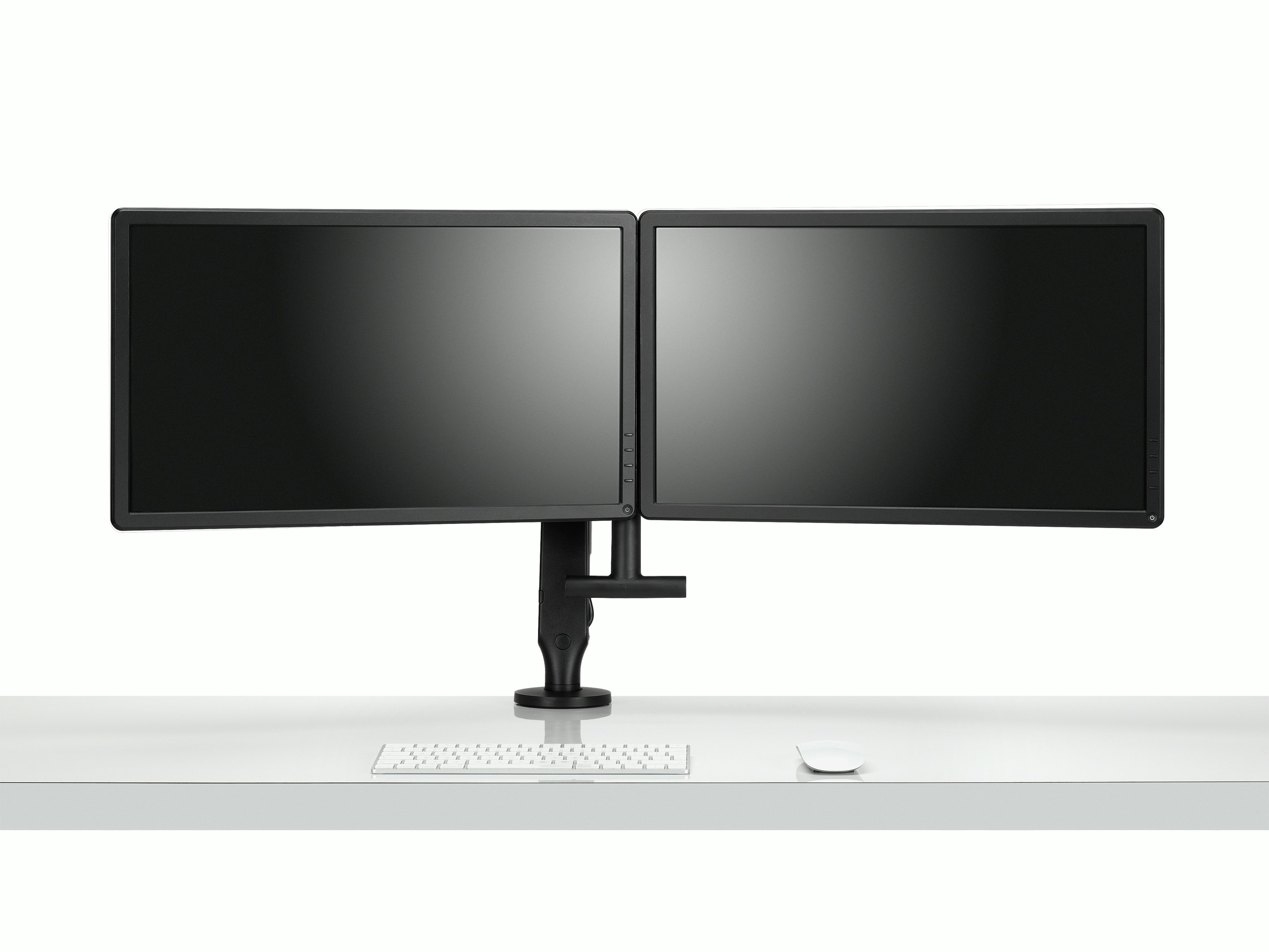 Front view of two monitors attached to a black Ollin Monitor Arm in dual configuration, and with the optional dual bar handle added to support ease of adjustment of screen position.