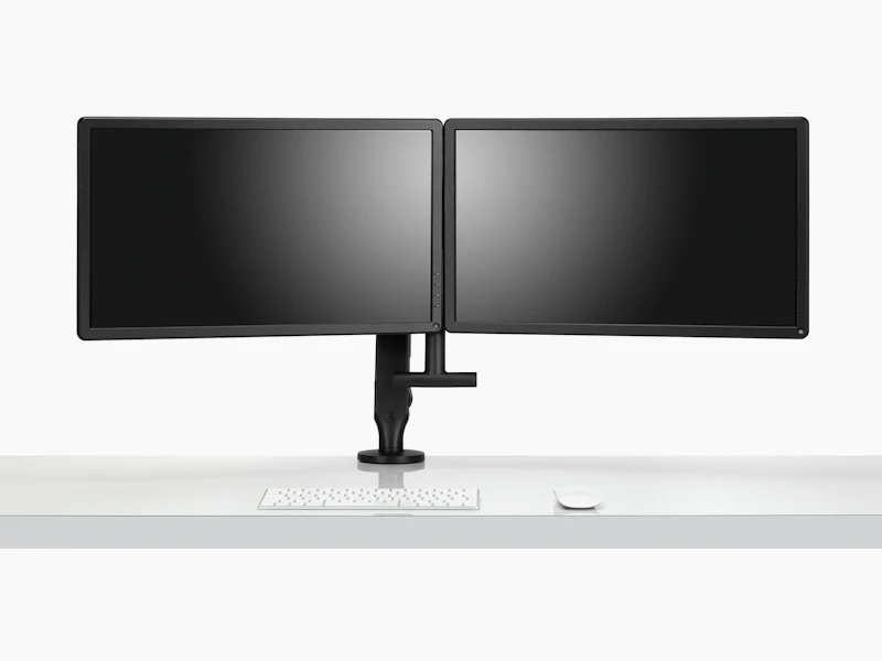 Front view of two monitors attached to a black Ollin Monitor Arm in dual configuration, and with the optional dual bar handle added to support ease of adjustment of screen position.