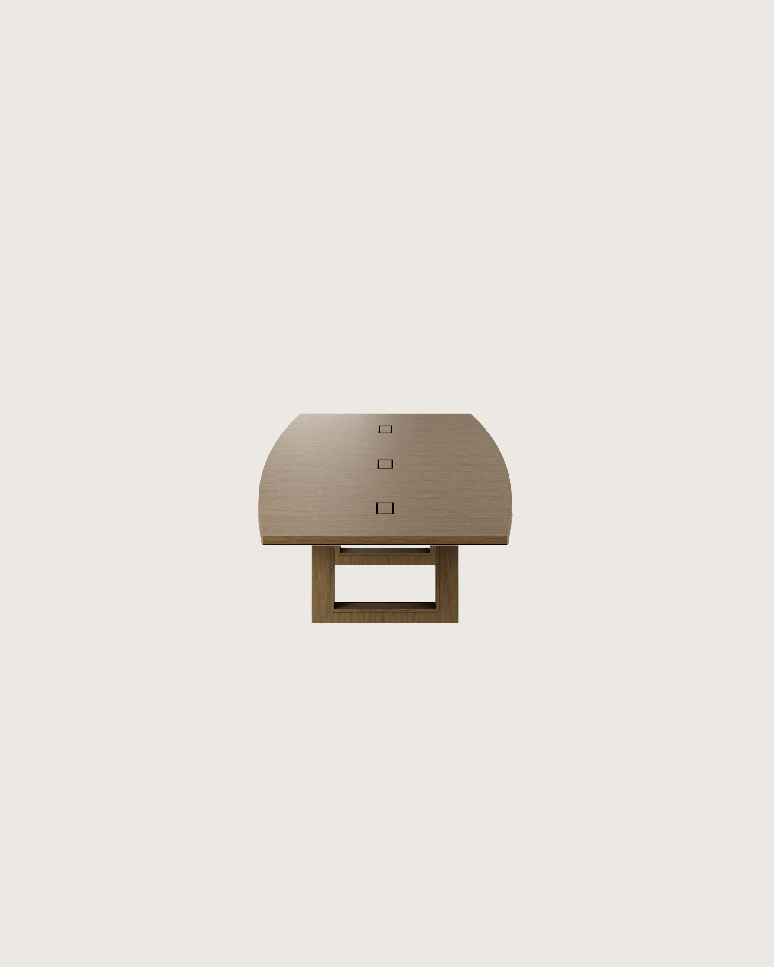 Boat-shaped Highline Fifty Conference Table in Natural Flat Cut Walnut with a Satin Nickel edge viewed from the side.